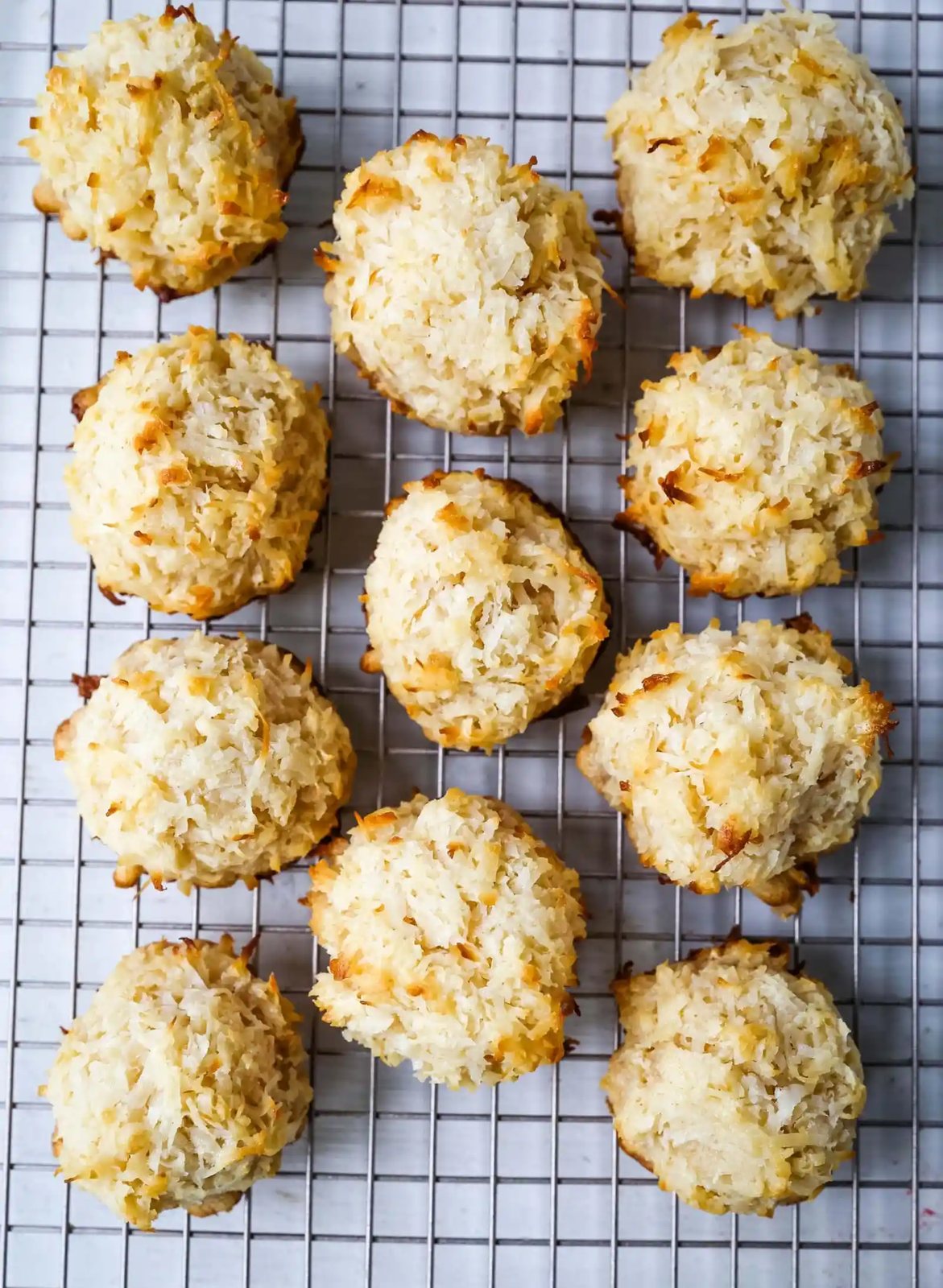 The Best Coconut Macaroons. Soft chewy sweet coconut macaroons are the perfect gluten-free cookie. How to make the perfect coconut macaroons dipped in dark chocolate. www.modernhoney.com #macaroons #coconutmacaroons #macaroon #christmascookie #christmascookies