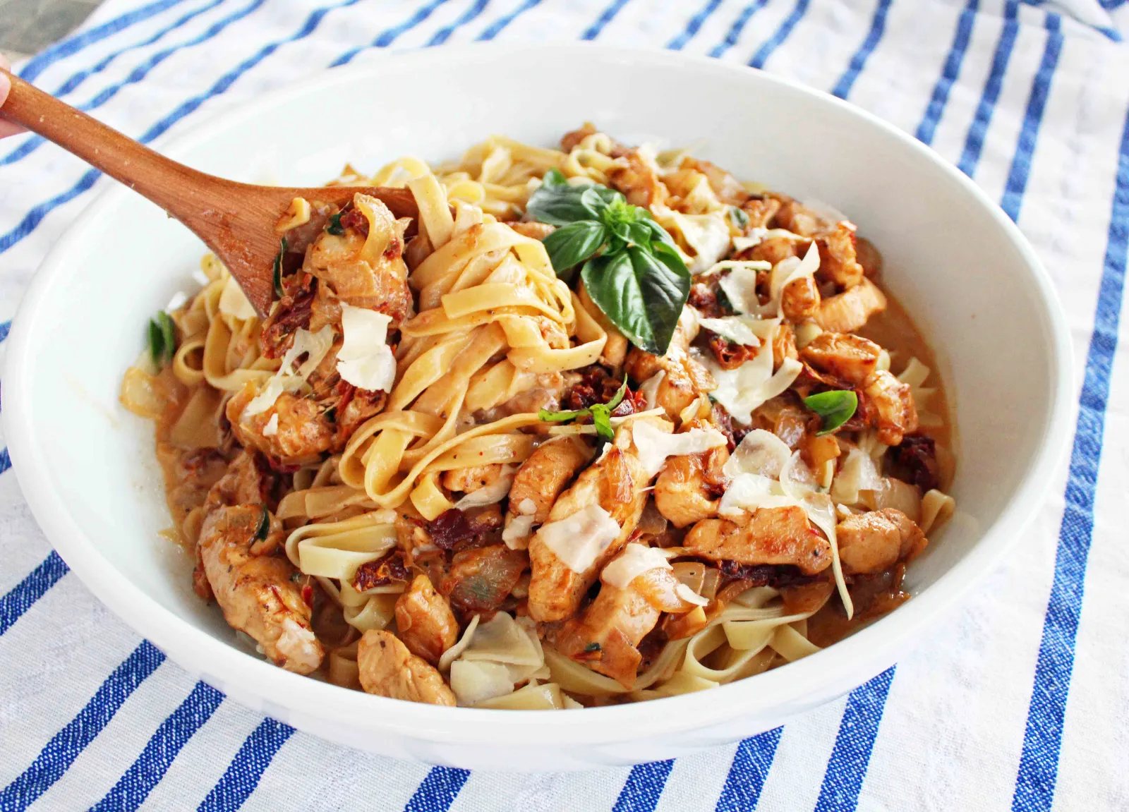 The Love Machine Chicken Pasta. Chicken sauteed in butter and garlic and rich sundried tomato cream sauce. Topped with freshly grated parmesan cheese and basil.