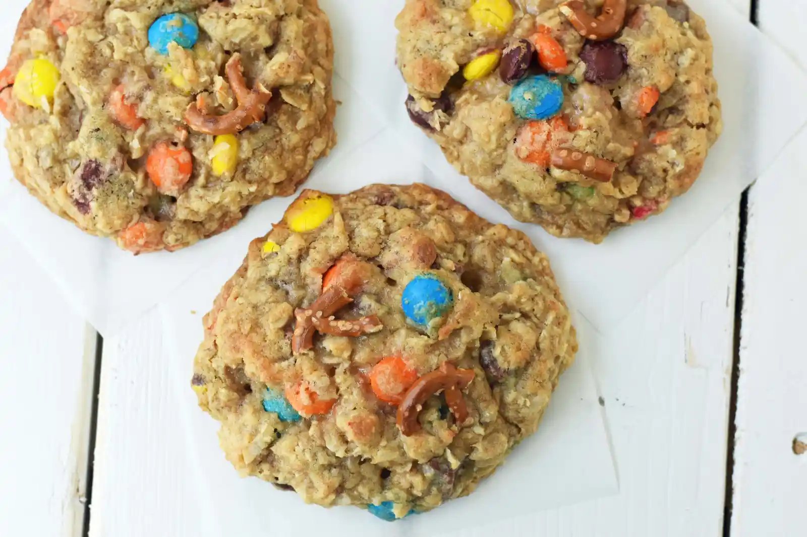 The Overachiever Oatmeal Pretzel M & M Cookie made with a sweet oatmeal cookie dough with oatmeal, shredded coconut, pretzels and M & M's. This Overachiever Cookie is the perfect balance of sweet and salty. www.modernhoney.com