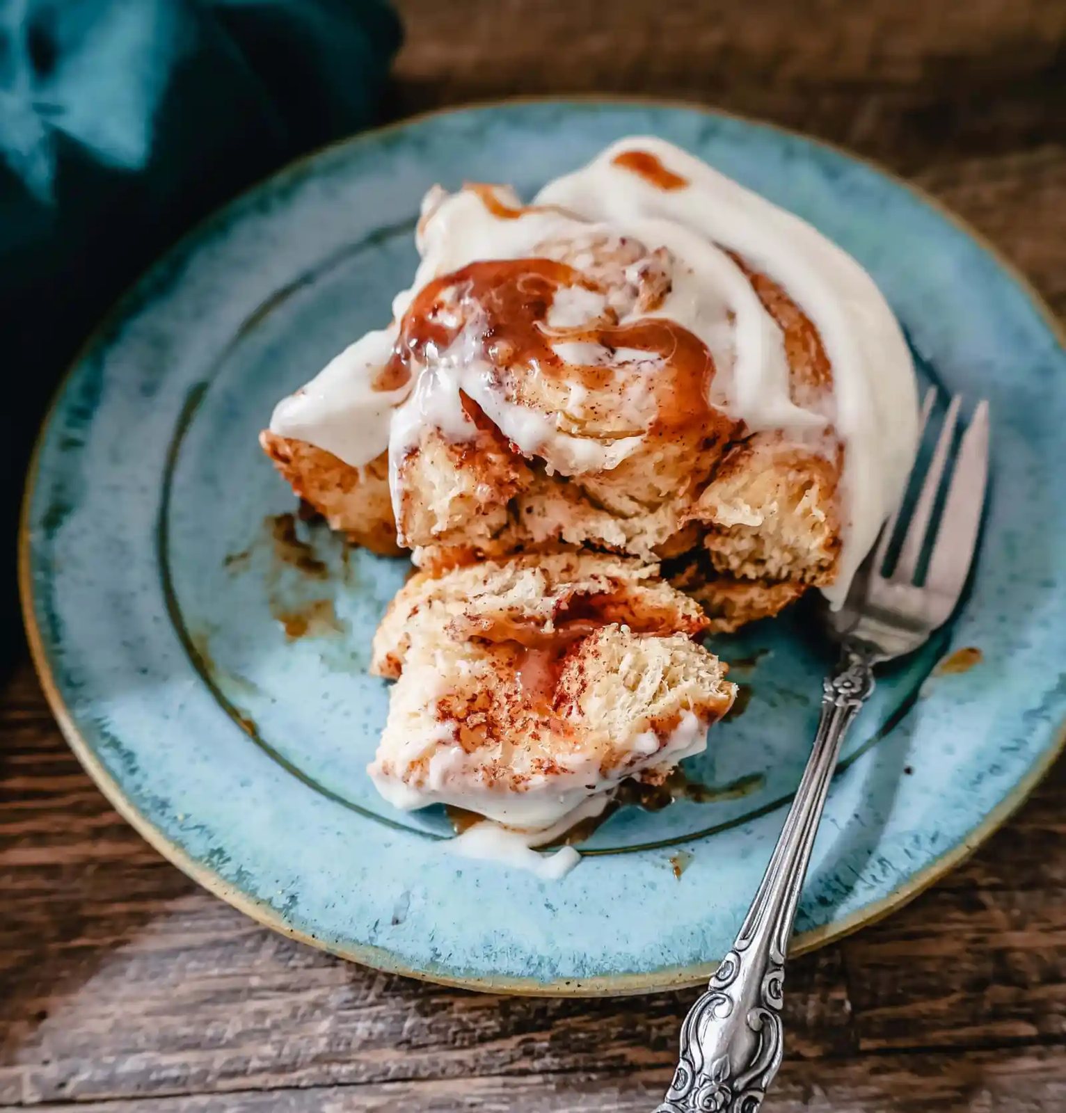 The famous, viral TikTok Cinnamon Rolls with heavy cream are even better than Cinnabon! These TikTok Cinnamon Rolls made with canned cinnamon rolls, a homemade buttery cinnamon drizzle, and a cream cheese frosting are the easiest cinnamon rolls you will ever make!