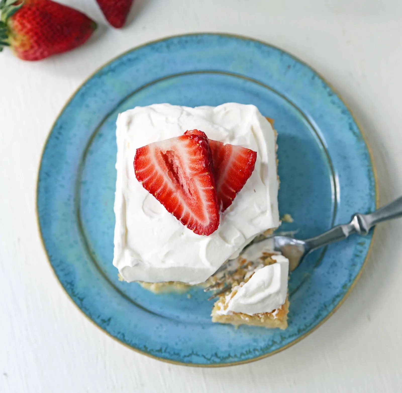 Tres Leches Cake. A classic Mexican dessert made with a vanilla sponge cake soaked with three kinds of milk -- heavy cream, evaporated milk and sweetened condensed milk and topped with whipped cream. www.modernhoney.com #treslechescake #threemilkcake #cincodemayo