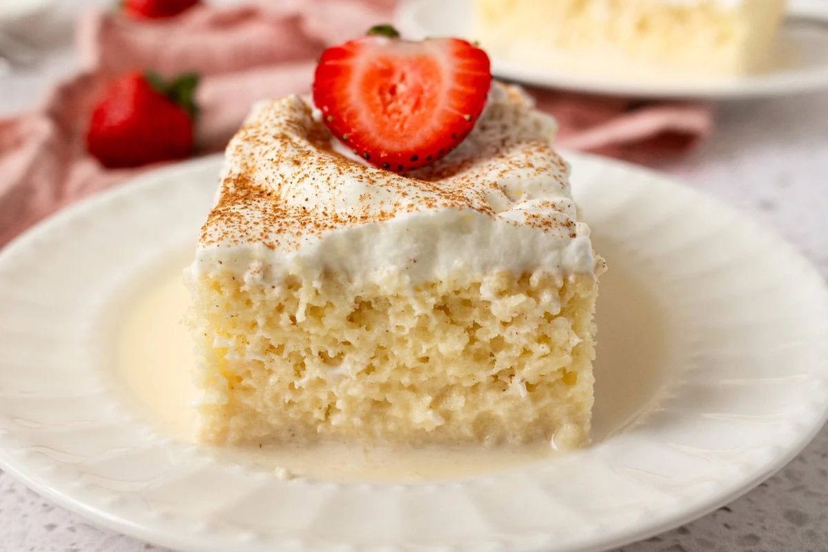 Tres Leches Cake. A classic Mexican dessert made with a vanilla sponge cake soaked with three kinds of milk -- heavy cream, evaporated milk and sweetened condensed milk and topped with fresh sweetened whipped cream. An authentic Mexican dessert recipe!