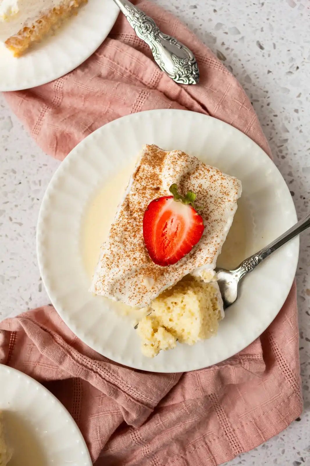 Tres Leches Cake. A classic Mexican dessert made with a vanilla sponge cake soaked with three kinds of milk -- heavy cream, evaporated milk and sweetened condensed milk and topped with fresh sweetened whipped cream. An authentic Mexican dessert recipe!