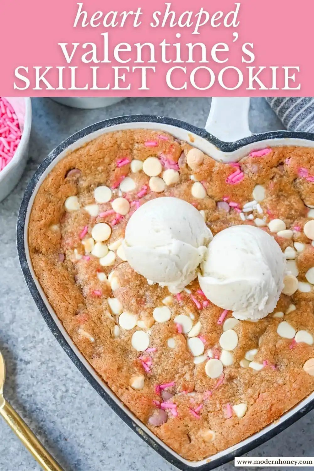 Valentine's Day Heart Skillet Cookie. Soft, chewy skillet cookie recipe filled with white chocolate chips, pink sprinkles, and any of your favorite festive additions such as Valentine's Day M&M's and ruby chocolate. Top it with vanilla ice cream and have the perfect Valentine's Day dessert.