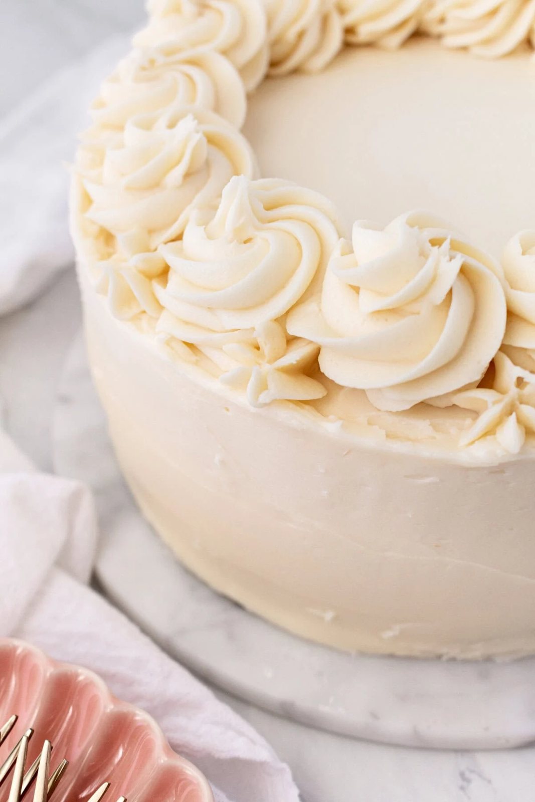 The best homemade vanilla cake recipe with vanilla bean buttercream frosting. If you’re looking for the best homemade vanilla cake recipe, this is it! This moist and fluffy vanilla cake is easy to make from scratch using simple ingredients. Perfect for birthdays or celebrations. This white cake recipe features a light, airy crumb and the most tender texture. This is a bakery-worthy dessert!