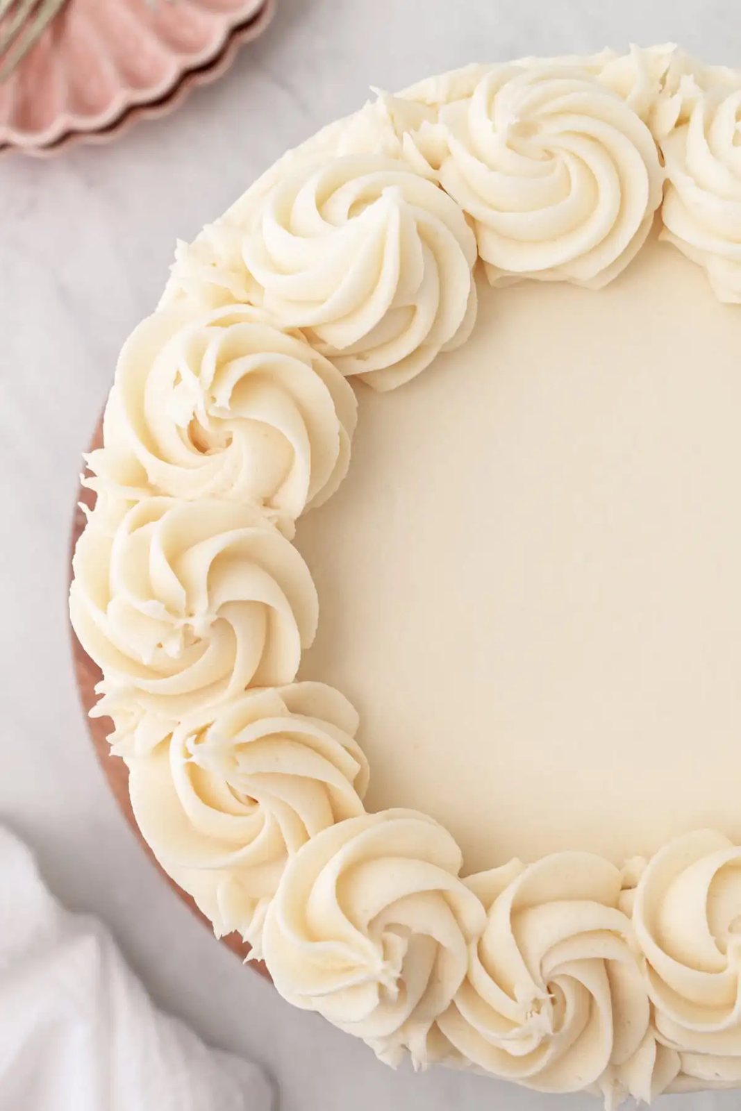 The best homemade vanilla cake recipe with vanilla bean buttercream frosting. If you’re looking for the best homemade vanilla cake recipe, this is it! This moist and fluffy vanilla cake is easy to make from scratch using simple ingredients. Perfect for birthdays or celebrations. This white cake recipe features a light, airy crumb and the most tender texture. This is a bakery-worthy dessert!
