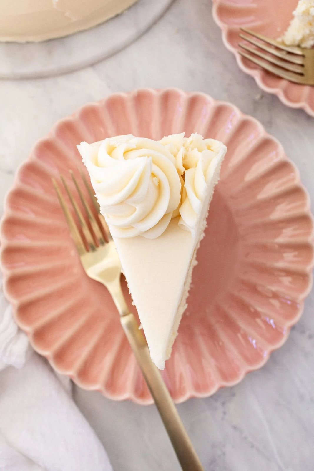 The best homemade vanilla cake recipe with vanilla bean buttercream frosting. If you’re looking for the best homemade vanilla cake recipe, this is it! This moist and fluffy vanilla cake is easy to make from scratch using simple ingredients. Perfect for birthdays or celebrations. This white cake recipe features a light, airy crumb and the most tender texture. This is a bakery-worthy dessert!