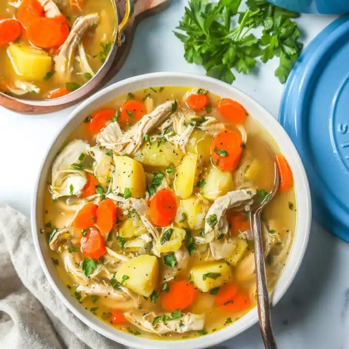 This Homemade Chicken Soup is made with tender chicken, carrots, onion, potatoes, fresh herbs, and seasonings all in a warm chicken broth. This is the perfect chicken soup on a cold winter's day.