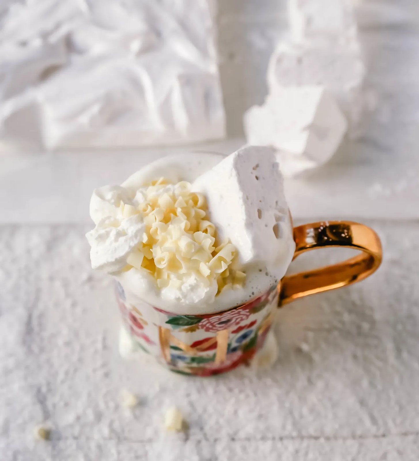 Homemade White Hot Chocolate Creamy, silky-smooth white chocolate made with white chocolate, whole milk, and vanilla beans. Topped with fresh whipped cream, homemade soft marshmallows, and white chocolate shavings. www.modernhoney.com #whitechocolate #hotwhitechocolate #whitehotchocolate