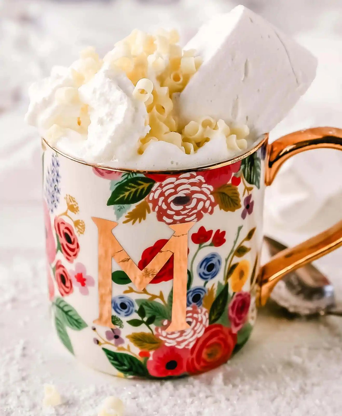 Homemade White Hot Chocolate Creamy, silky-smooth white chocolate made with white chocolate, whole milk, and vanilla beans. Topped with fresh whipped cream, homemade soft marshmallows, and white chocolate shavings. www.modernhoney.com #whitechocolate #hotwhitechocolate #whitehotchocolate