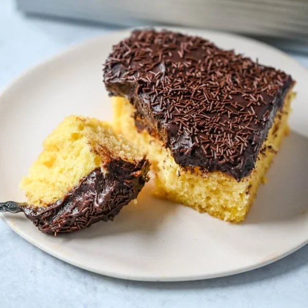 This yellow sheet cake with chocolate frosting is soft, buttery, and perfectly moist with a rich, classic flavor. The fluffy yellow sheet cake pairs beautifully with a smooth, creamy chocolate frosting that melts in every bite. The best yellow cake with chocolate frosting!