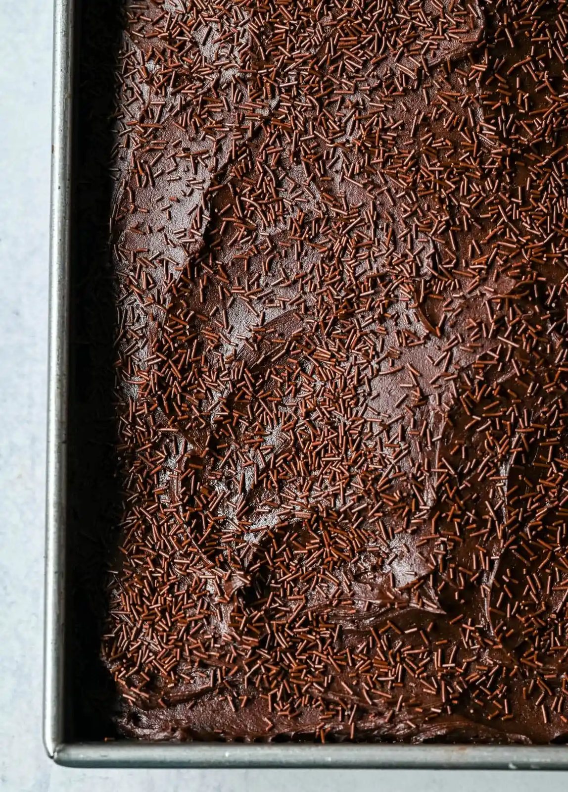 This yellow sheet cake with chocolate frosting is soft, buttery, and perfectly moist with a rich, classic flavor. The fluffy yellow sheet cake pairs beautifully with a smooth, creamy chocolate frosting that melts in every bite. The best yellow cake with chocolate frosting!