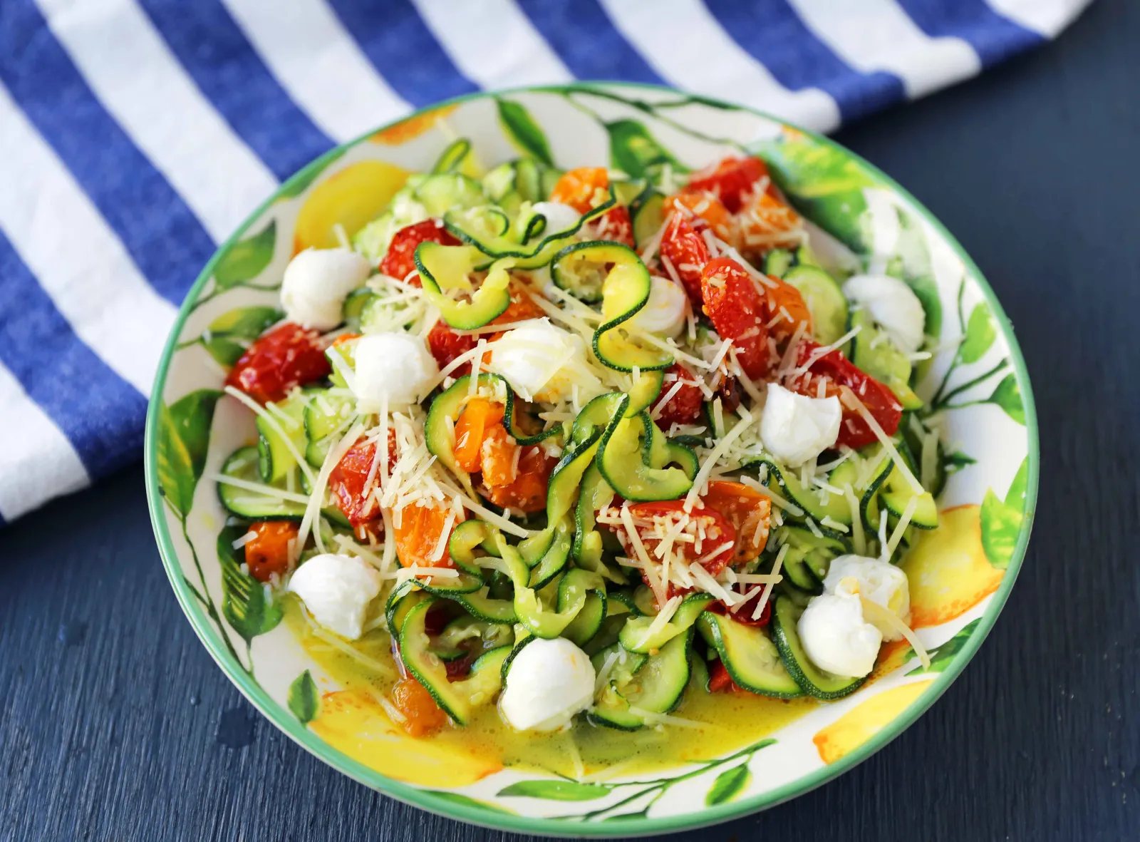 Zucchini Noodles with Tomatoes, Fresh Mozzarella, and Basil. How to make spiralized zucchini noodles (zoodles). Healthy, delicious, and flavorful side dish. The best way to eat your veggies! www.modernhoney.com #zoodles #zucchini #zucchininoodles