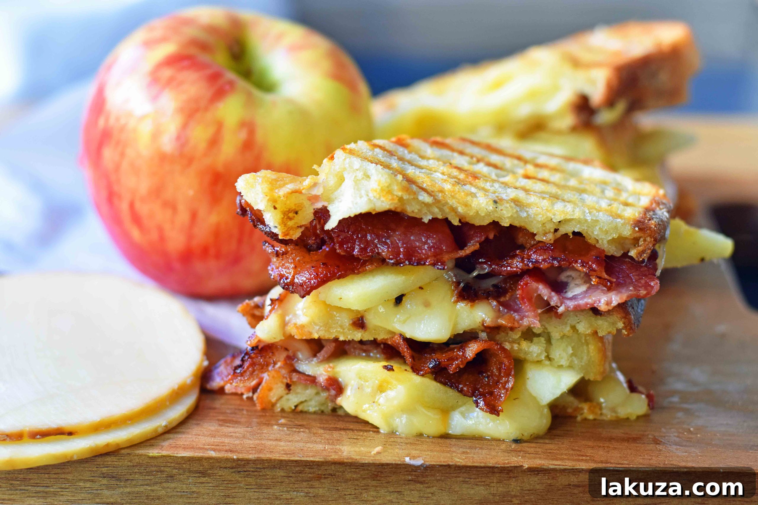 Honeycrisp Apple & Smoky Bacon Gouda Melt 4 A gourmet grilled cheese sandwich featuring smoked gouda, honeycrisp apple, and bacon, served on toasted sourdough bread. Delicious and easy recipe.