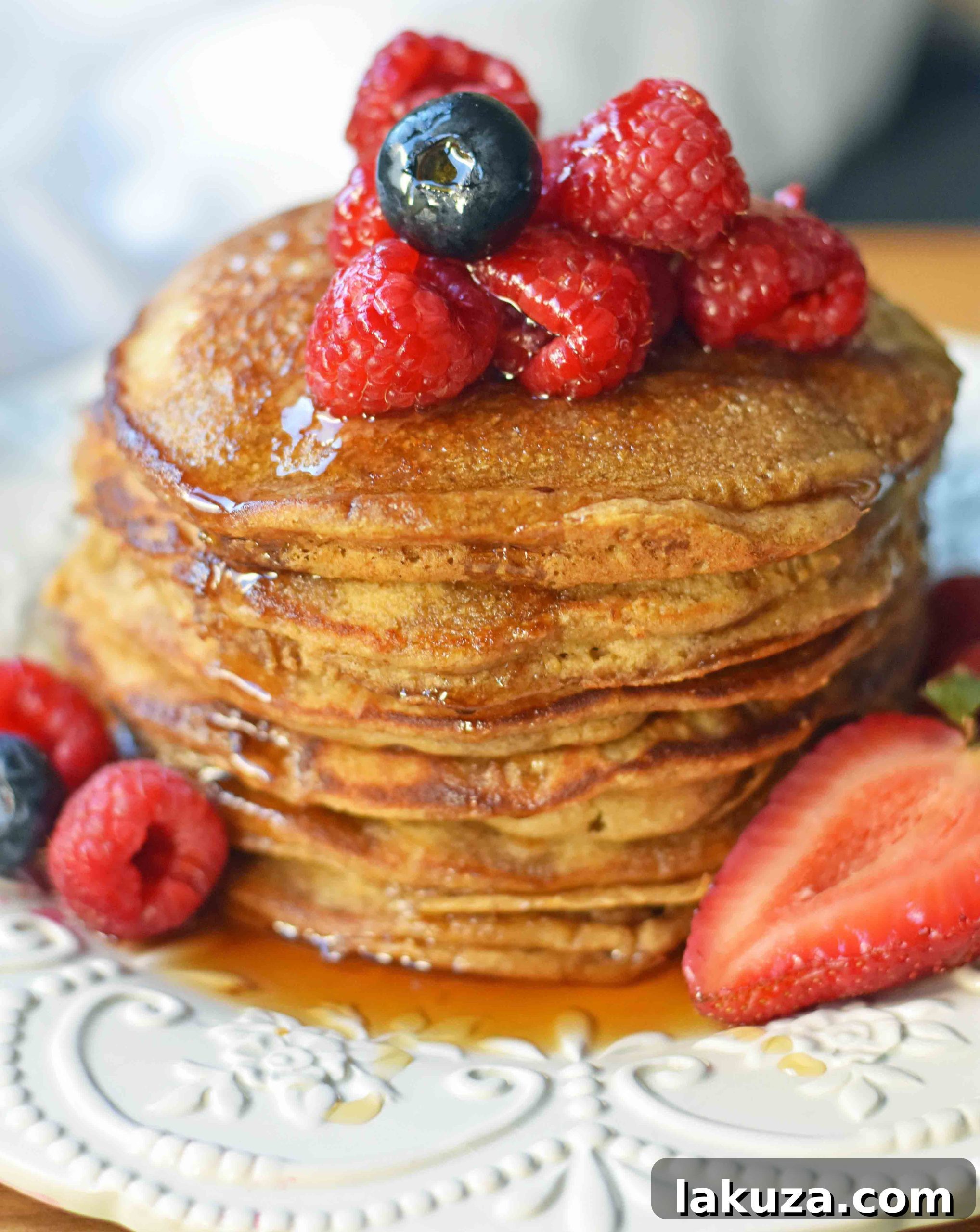 Protein Power Pancakes 2 Gluten-free and dairy-free protein pancakes with collagen, topped with berries and maple syrup. A healthy breakfast recipe.