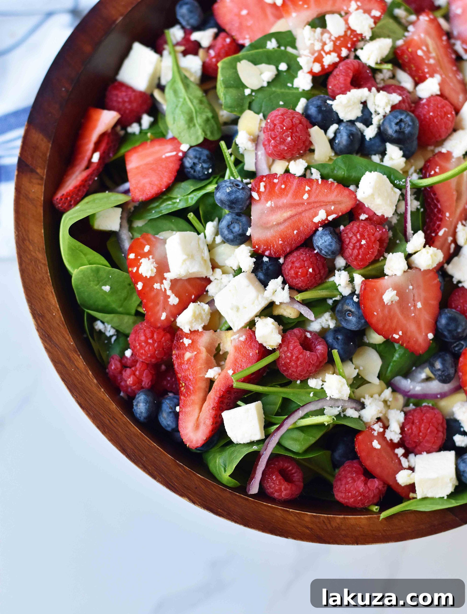 Sweet Poppy Seed Dressed Spinach Berry Salad 2 Spinach Berry Salad with Sweet Poppyseed Dressing. Fresh Spinach Salad with Berries, Feta Cheese, and Poppy Seed Dressing. A vibrant and healthy salad perfect for summer gatherings.