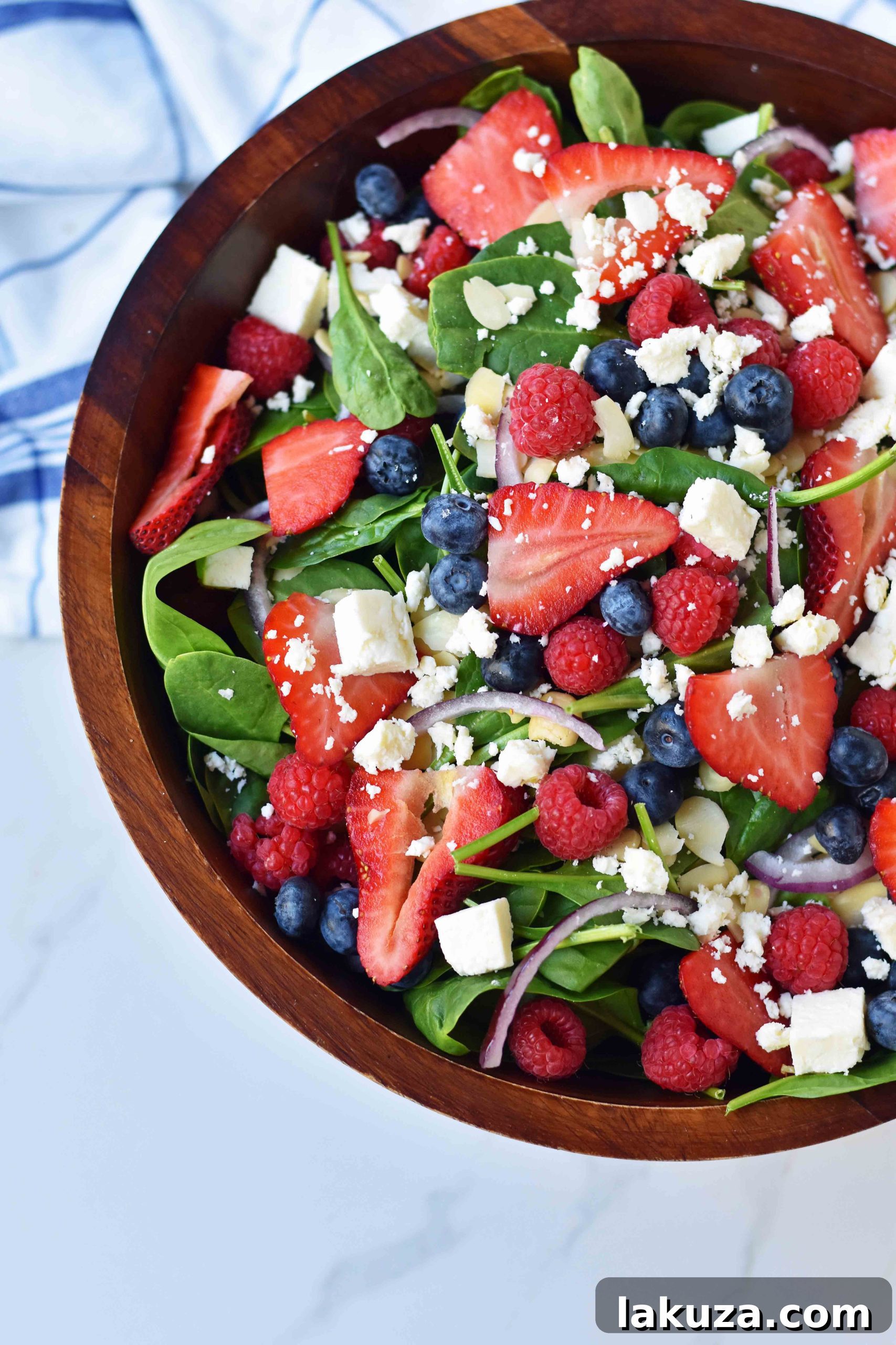 Sweet Poppy Seed Dressed Spinach Berry Salad 5 Spinach Berry Salad with Sweet Poppyseed Dressing. Fresh Spinach Salad with Berries, Feta Cheese, and Poppy Seed Dressing. Salad ready to eat.