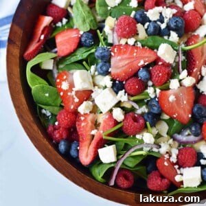 Spinach Berry Salad with Sweet Poppyseed Dressing. Fresh Spinach Salad with Berries, Feta Cheese, and Poppy Seed Dressing. Recipe card image.
