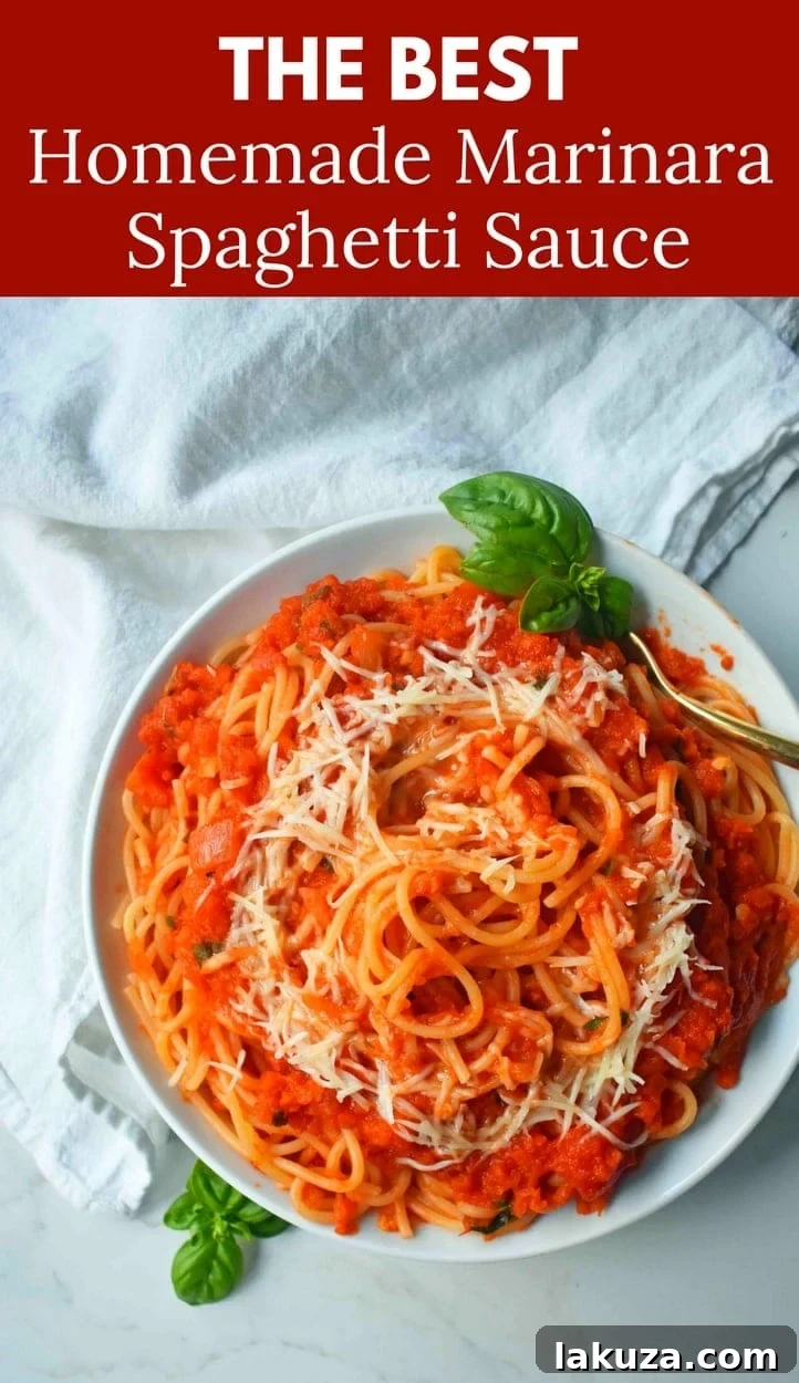 Slow-Simmered Family Marinara 7 A top-down view of a richly textured homemade marinara spaghetti sauce, garnished with fresh basil.