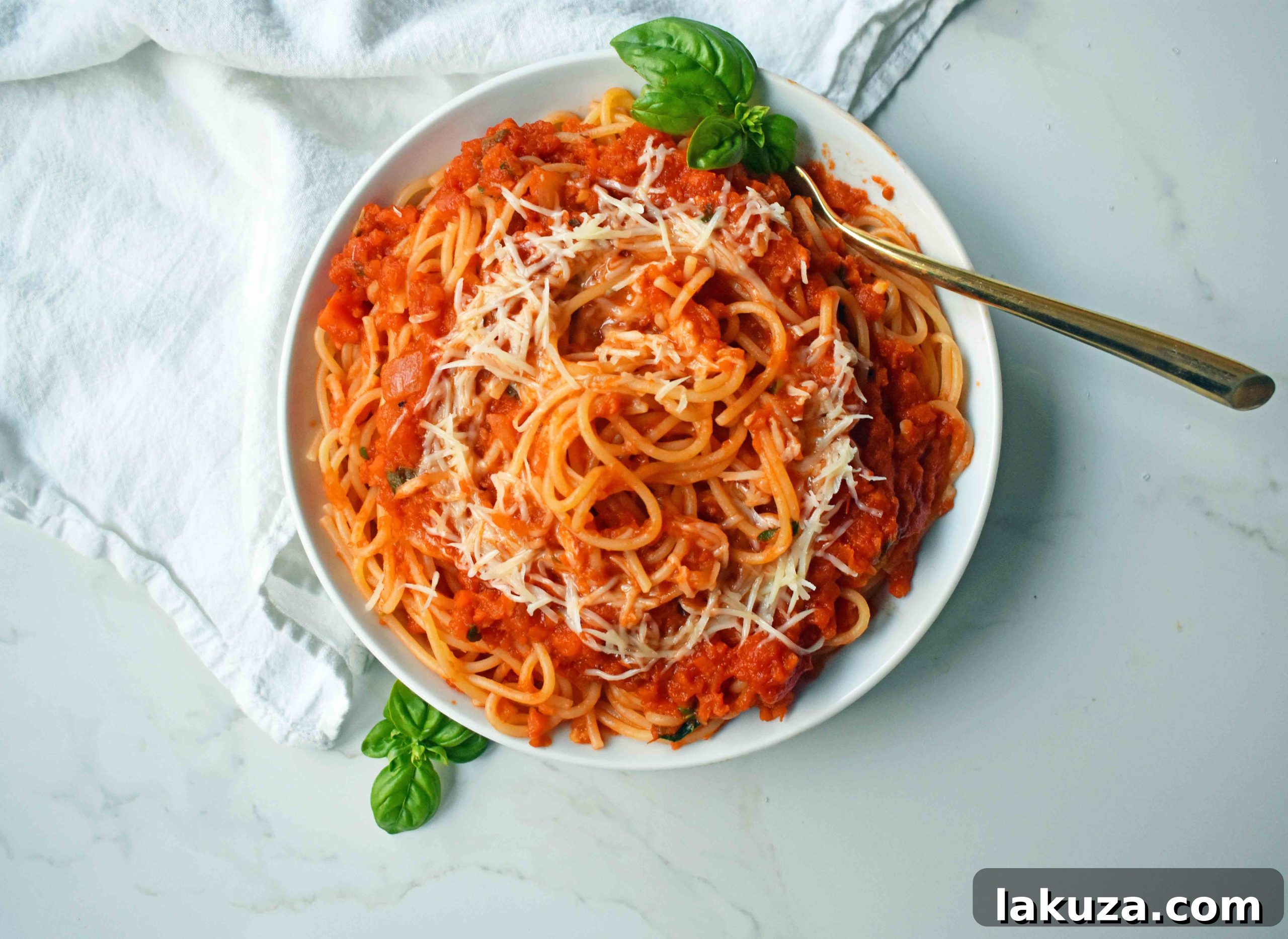 Slow-Simmered Family Marinara 5 A large pot of perfectly cooked spaghetti tossed with homemade marinara sauce, ready to be served.