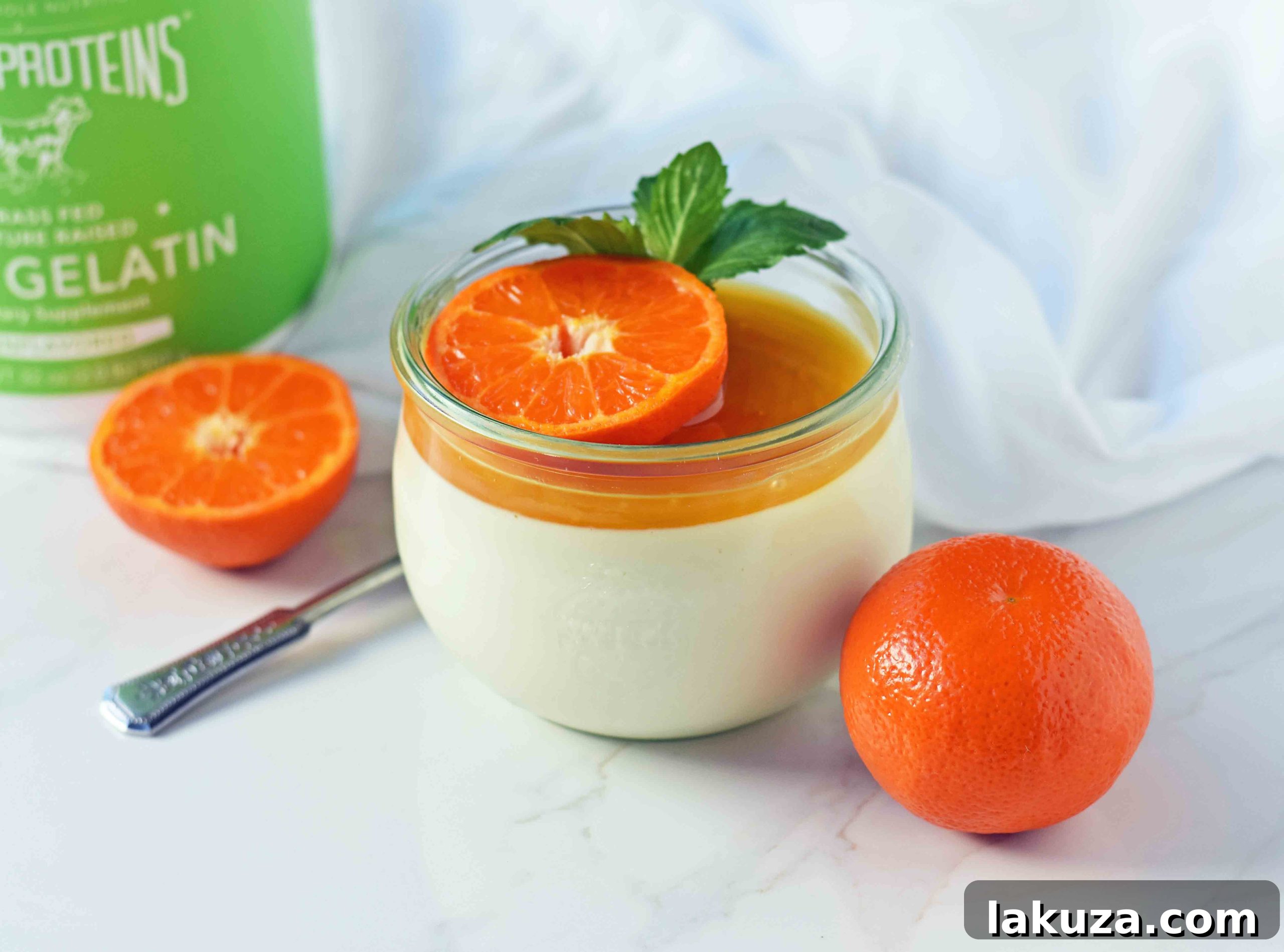 Tangy Greek Yogurt Panna Cotta 9 Delectable Greek Yogurt Panna Cotta in small glass jars, ready to be enjoyed, garnished with a sprinkle of nuts and fresh fruit. A perfect portion-controlled and easy dessert.
