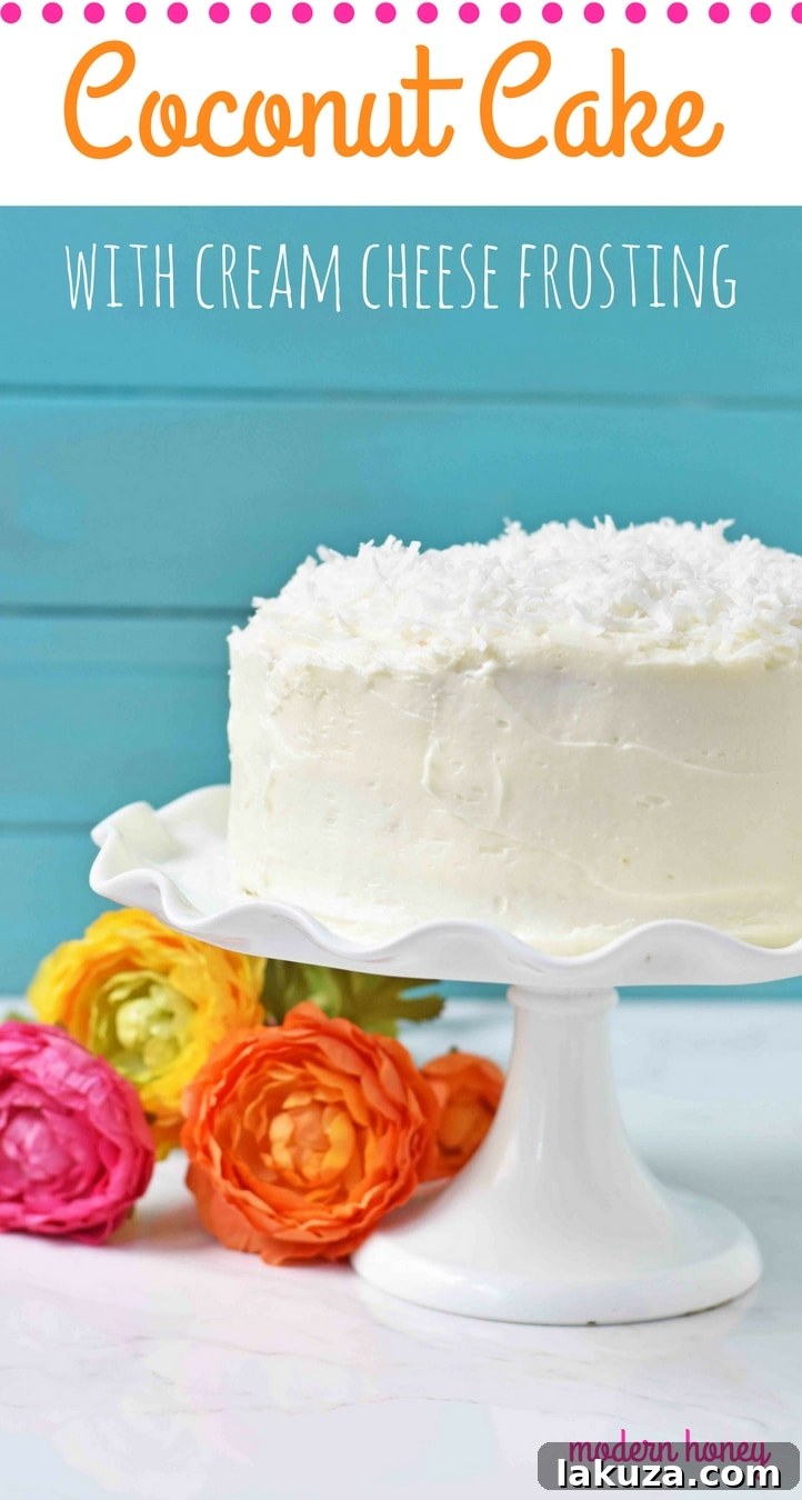 A perfectly baked and frosted coconut cake, garnished with shredded coconut, showcasing its moist layers and creamy texture. This is the best Southern Coconut Cake Recipe.