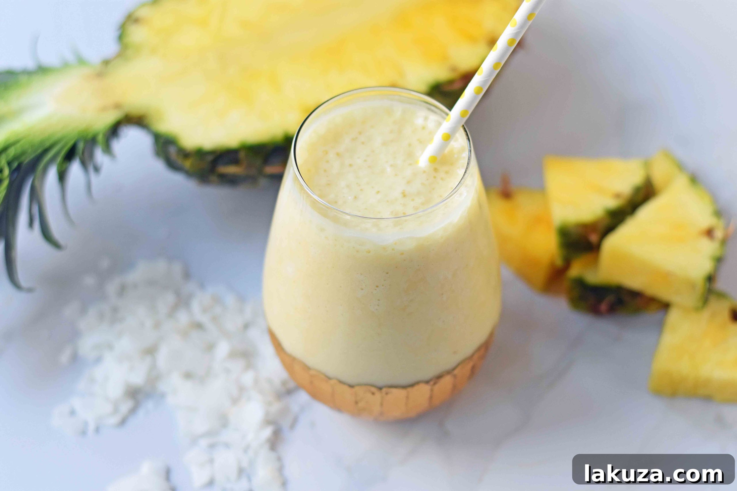 Healthy Pina Colada Smoothie. Fresh pineapple, coconut milk, banana, a touch of honey, and optional coconut yogurt. A creamy sweet healthy coconut pineapple smoothie. www.modernhoney.com