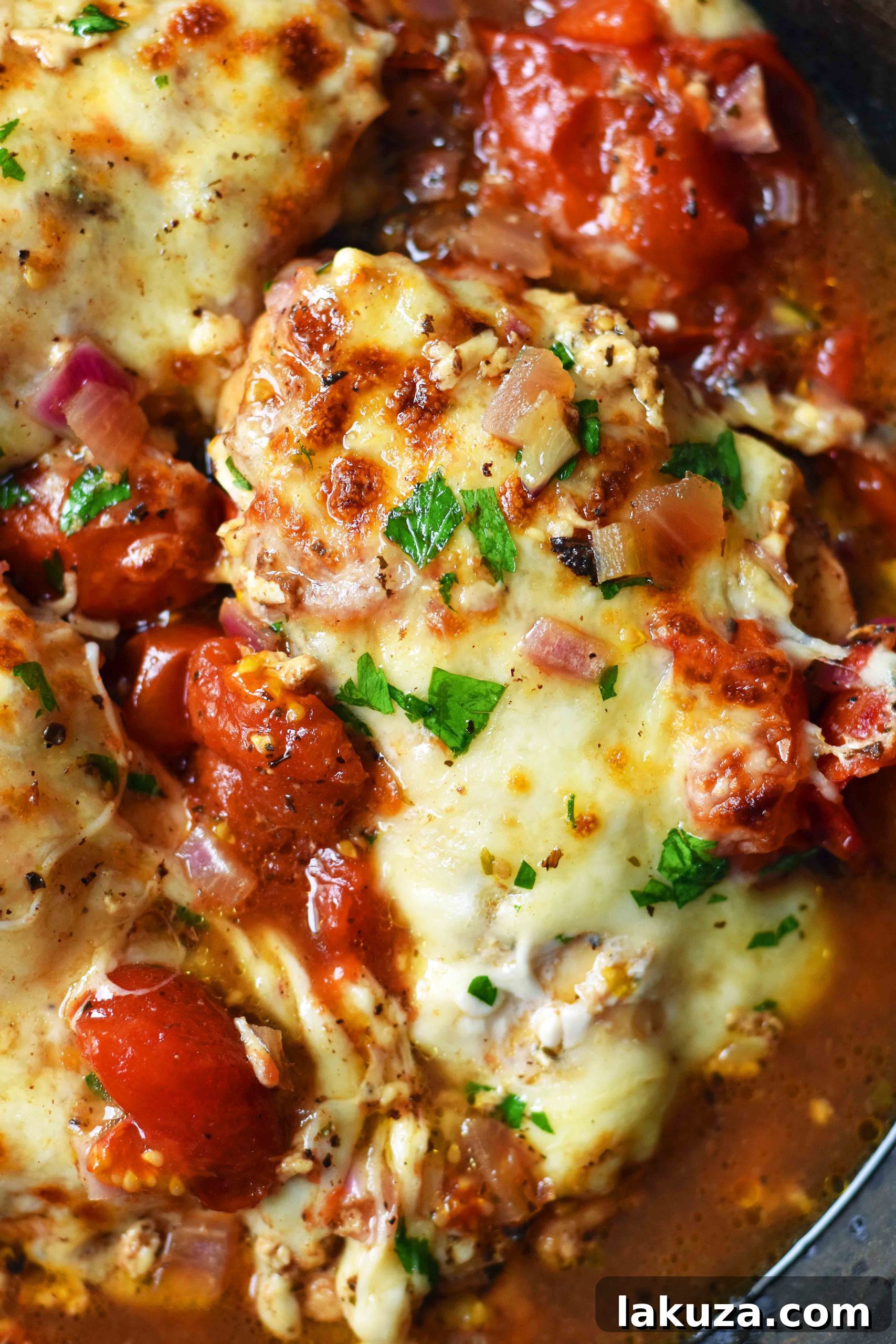 Oven-Roasted Chicken Caprese with Italian Herbs, Balsamic Tomatoes, and Melted Mozzarella. A quick and easy 30-minute dinner that will become a family favorite. Featuring boneless chicken breast with perfectly roasted grape tomatoes and fresh, bubbly mozzarella cheese. A perfect healthy weeknight meal.