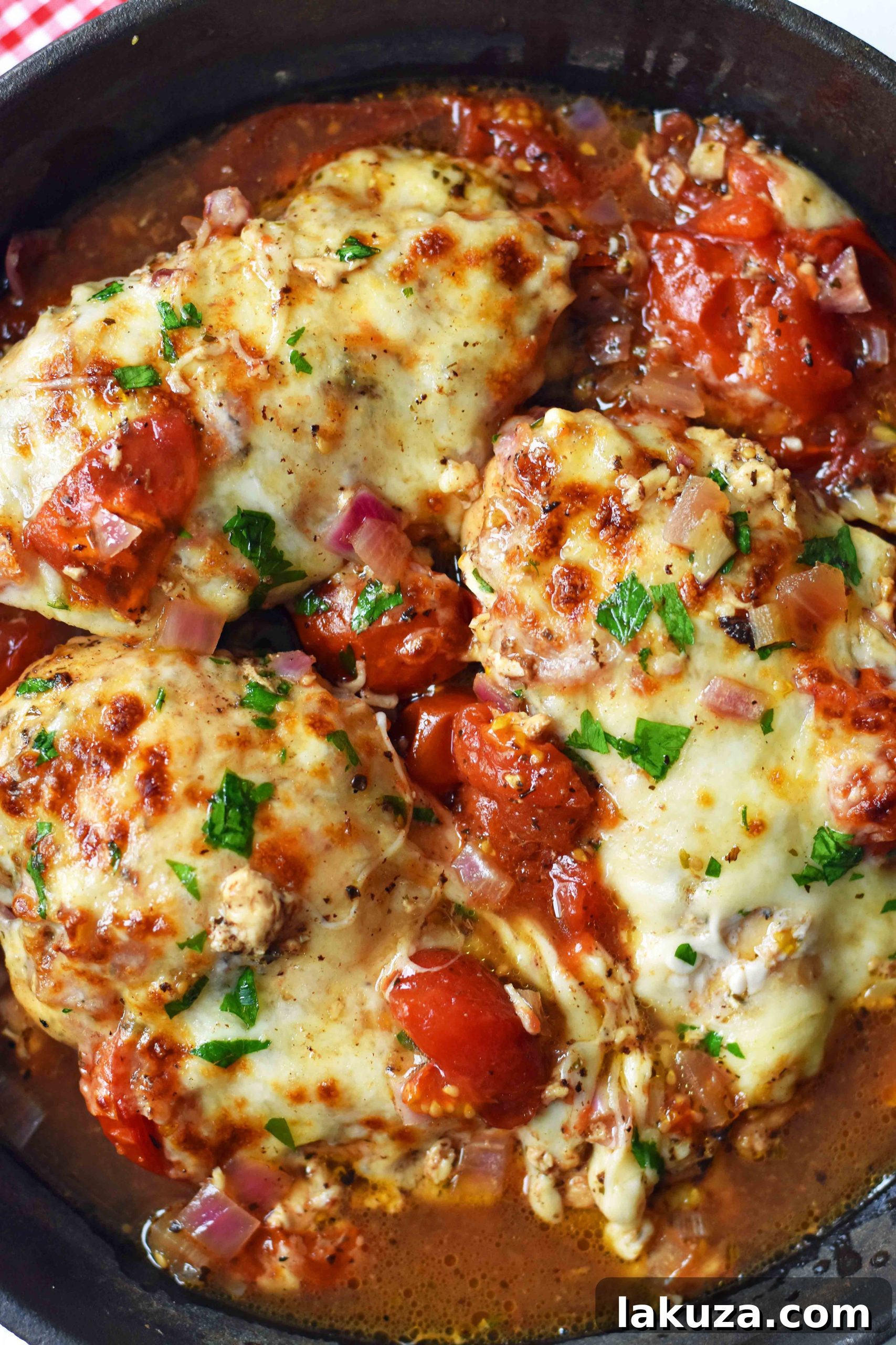 Delicious Baked Chicken Caprese. Features oven-roasted chicken breast with vibrant Italian herbs, sweet balsamic-roasted tomatoes, and a generous layer of melted fresh mozzarella. A quick and easy 30-minute dinner idea that your entire family will absolutely adore. Perfect for a healthy and satisfying meal.