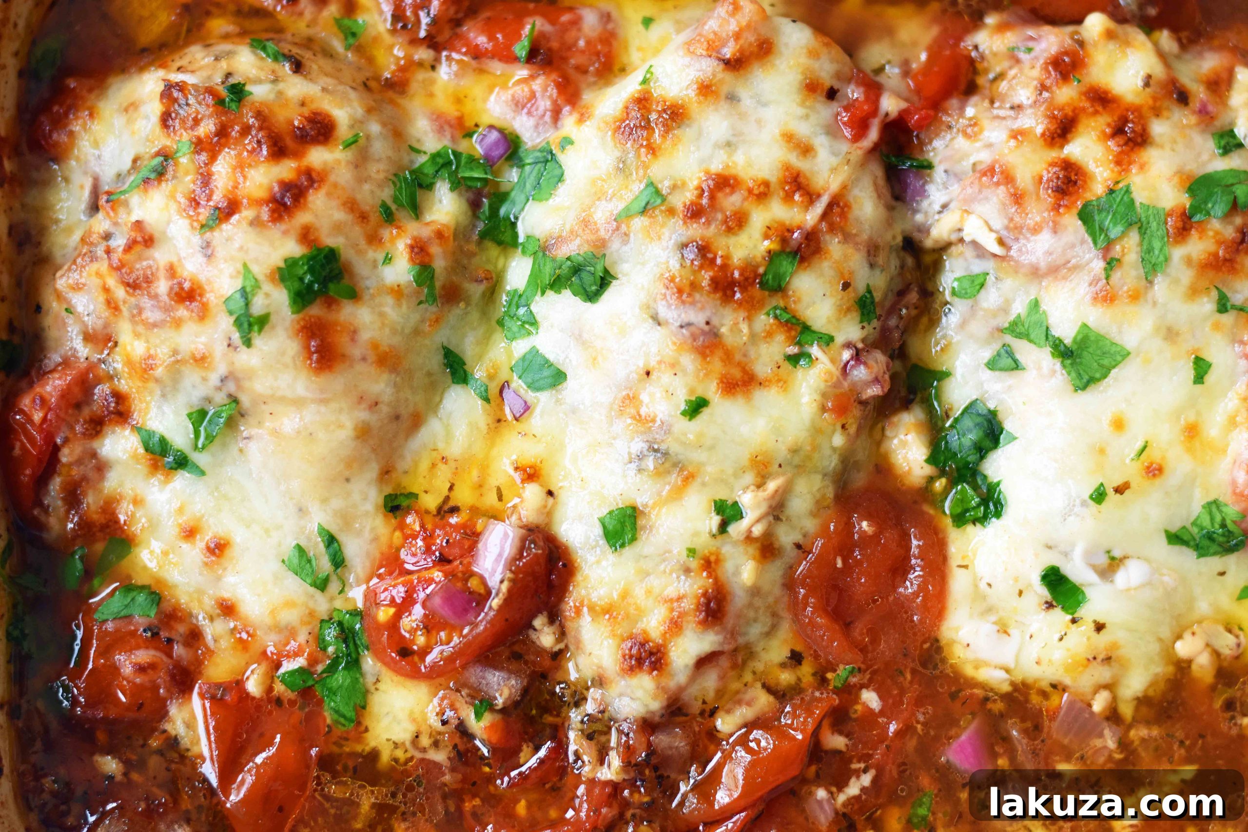 Easy 30-Minute Baked Chicken Caprese. Features juicy oven-roasted chicken with savory Italian seasonings, sweet balsamic tomatoes, and melted fresh mozzarella cheese. This simple and delicious recipe is a perfect weeknight meal that your whole family will absolutely love. Best served with a drizzle of pan sauce.