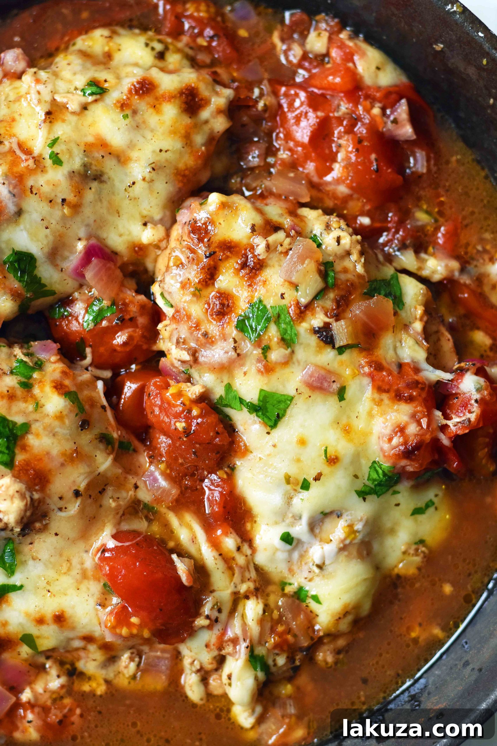 Caprese Chicken Baked to Perfection. A delightful oven-roasted chicken dish featuring classic Italian spices, sweet balsamic-roasted tomatoes, and a generous topping of melted mozzarella cheese. This quick and easy 30-minute meal is a guaranteed hit for any family dinner, showcasing tender chicken breast with fresh toppings.
