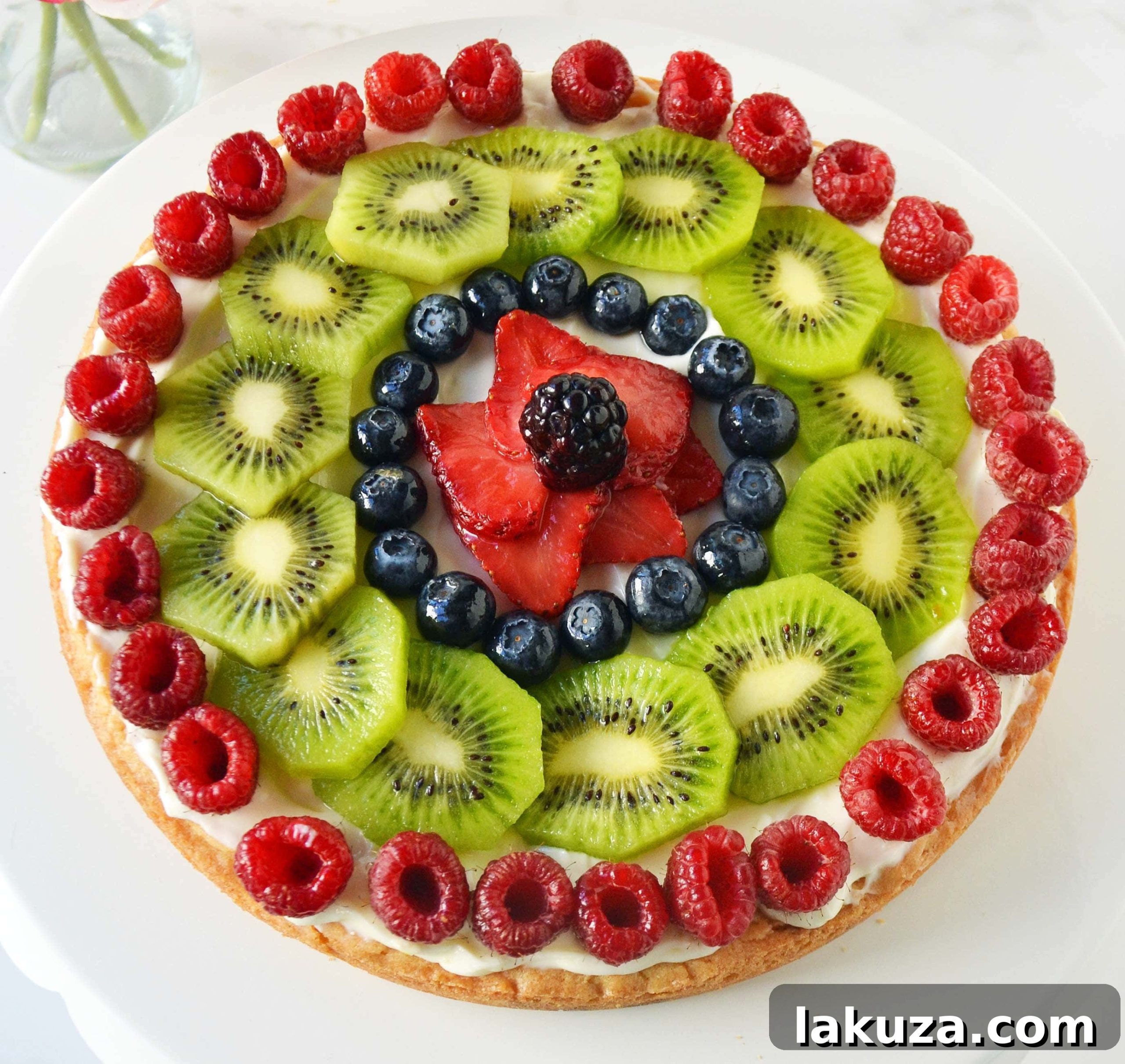 White Chocolate Macadamia Fruit Pizza Tart by Modern Honey - A vibrant and delightful dessert for any occasion, featuring a chewy cookie crust.