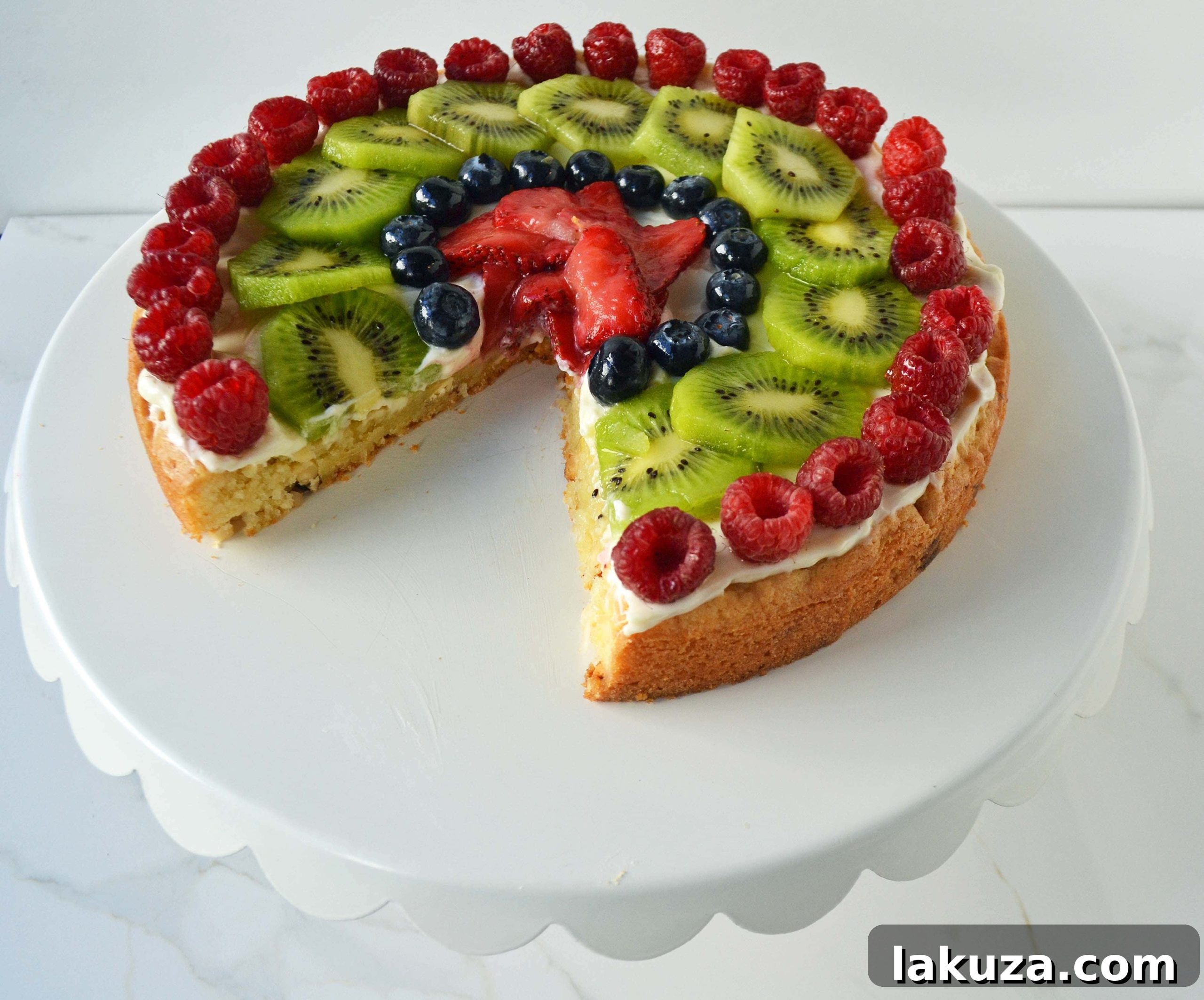 A beautifully decorated White Chocolate Macadamia Fruit Pizza Tart ready to be served.