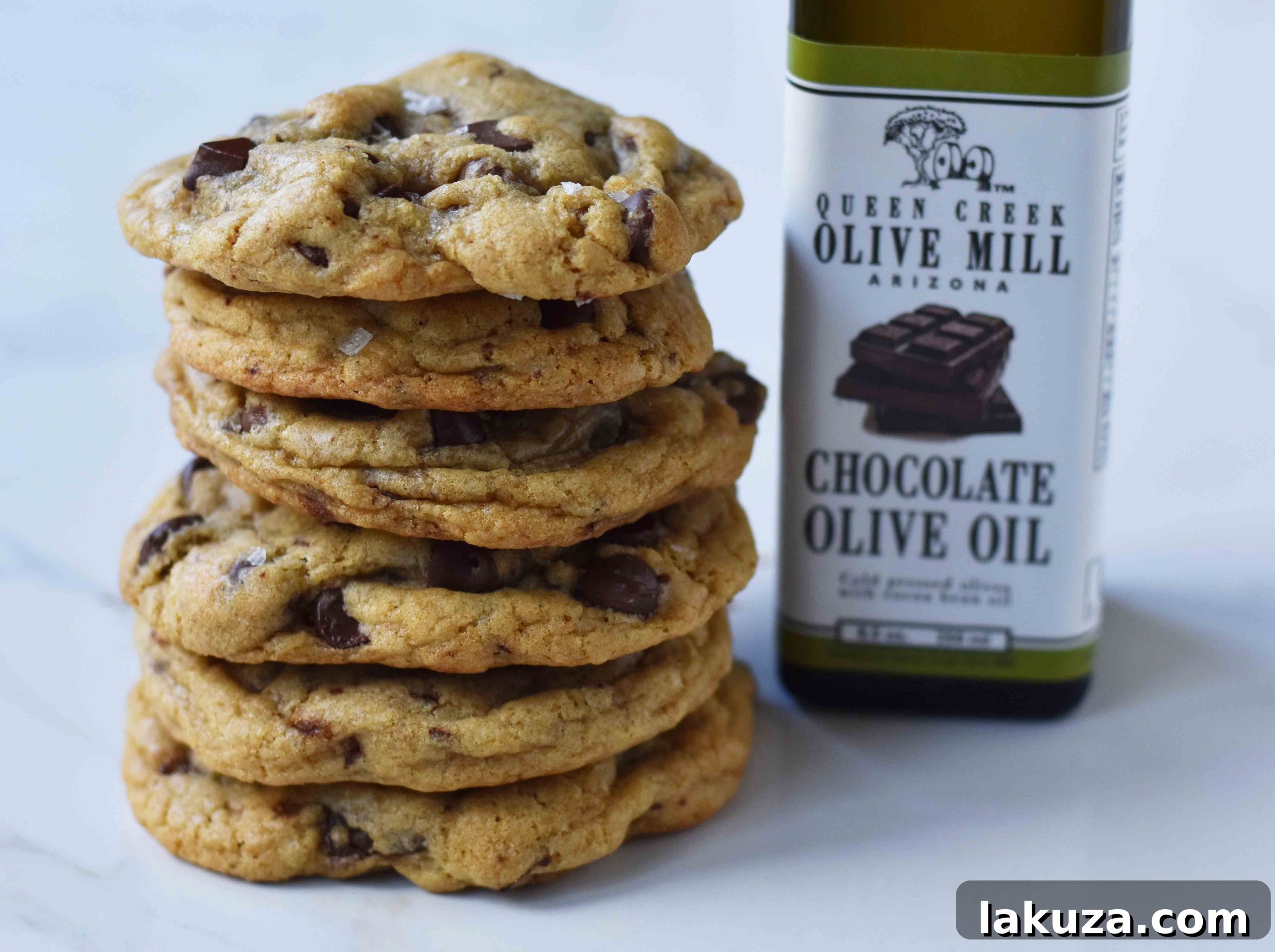 Rich Dark Chocolate Olive Oil Cookies 3 Close-up of freshly baked Dark Chocolate Chunk Olive Oil Cookies, showcasing the gooey chocolate and sea salt flakes.