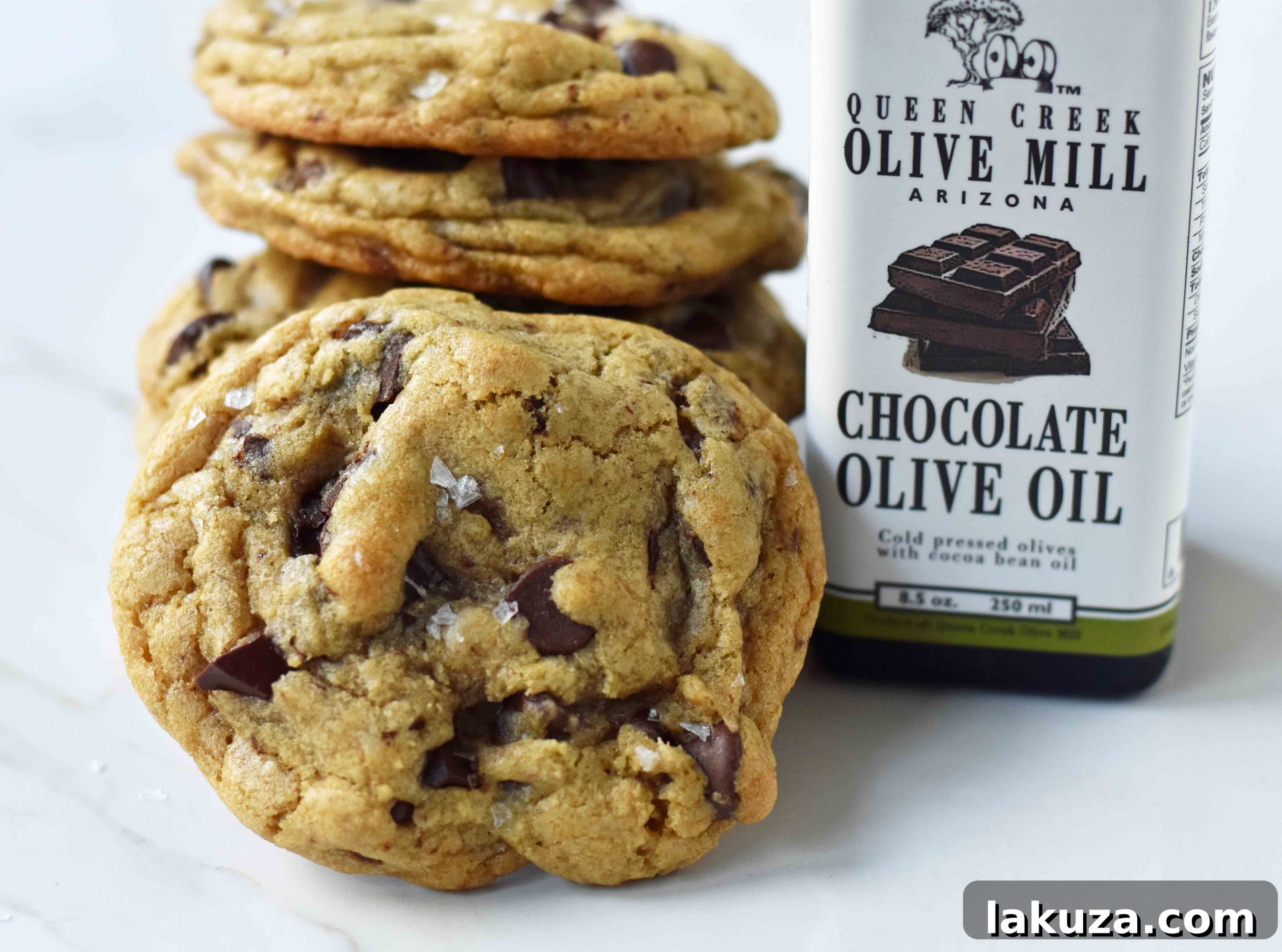 Rich Dark Chocolate Olive Oil Cookies 5 Plate of freshly baked Dark Chocolate Chunk Olive Oil Cookies with a perfect balance of chewiness and crispiness.