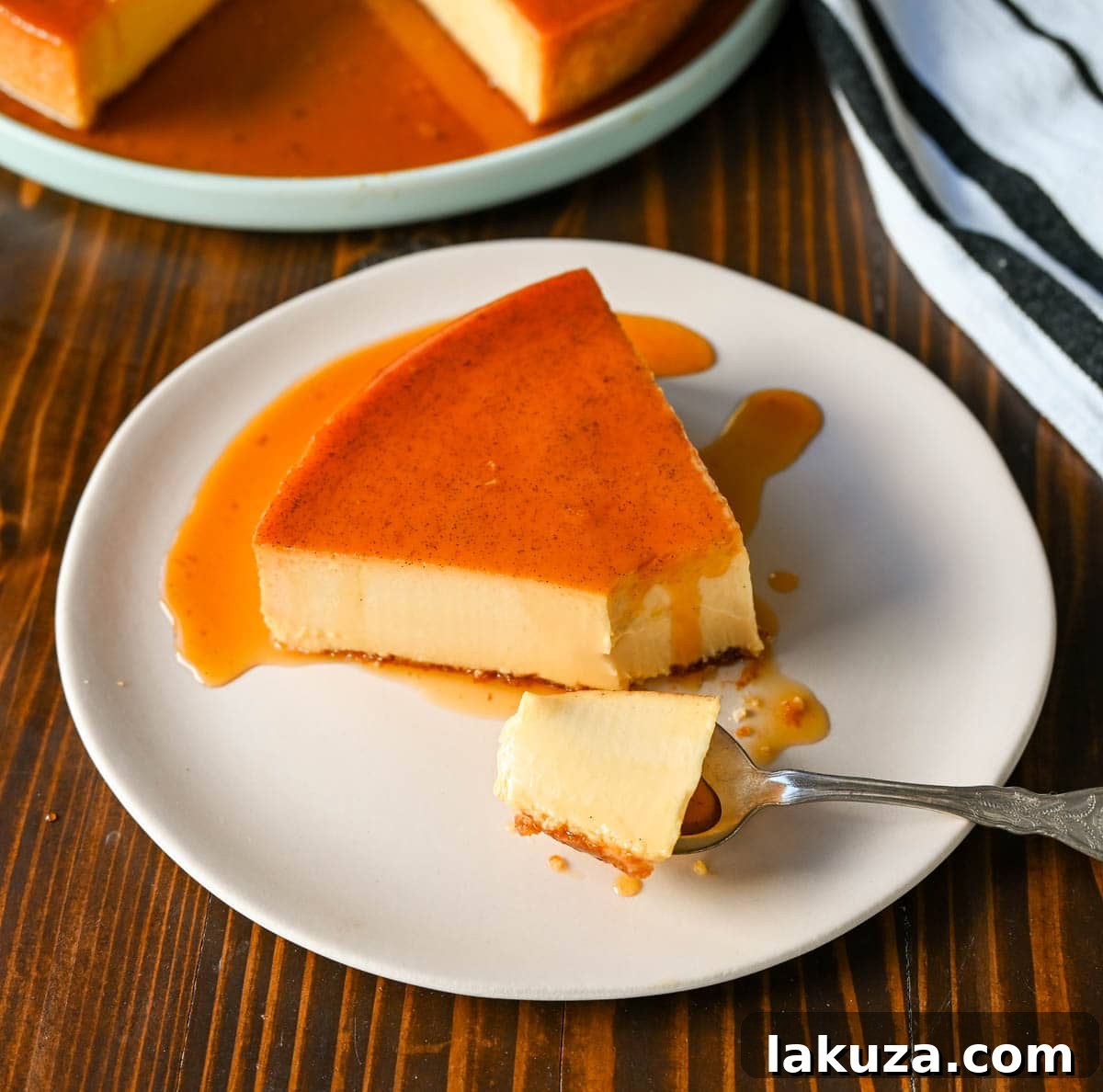 Silky Smooth Caramel Flan 3 Making Caramel Flan. A perfectly smooth and creamy flan baking in a water bath. This image showcases the careful process and pristine result of creating the best flan, featuring its signature caramelized sugar topping and rich custard texture, enhanced by a secret ingredient.