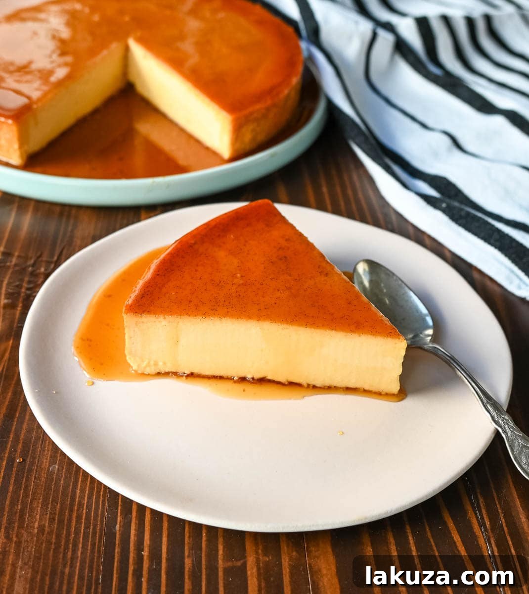 Silky Smooth Caramel Flan 7 Sliced Caramel Flan ready to serve. This image displays a slice of the best flan recipe, showcasing its creamy interior and rich caramel sauce. It’s a traditional flan dessert with a secret ingredient for enhanced smoothness, perfect for any special occasion.