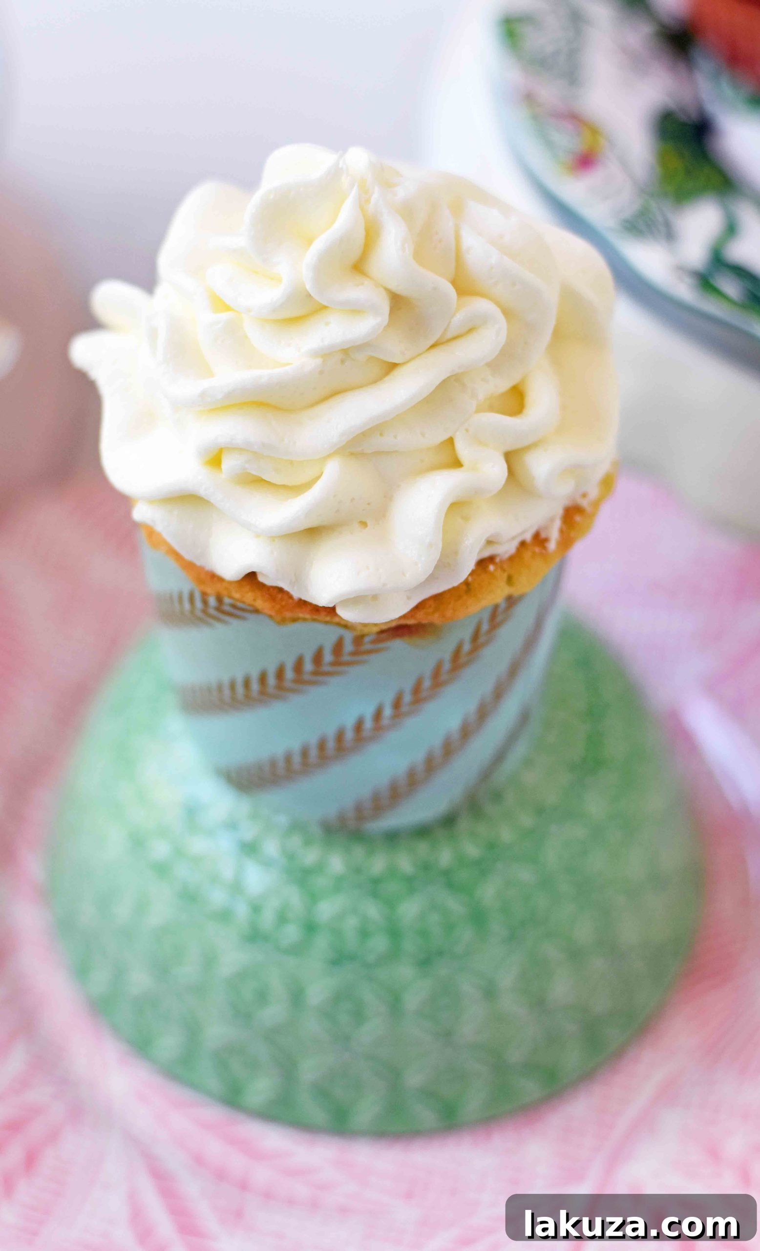 Perfect Vanilla Cupcakes 4 Several vanilla cupcakes arranged elegantly, each frosted with creamy vanilla buttercream and ready to be served.