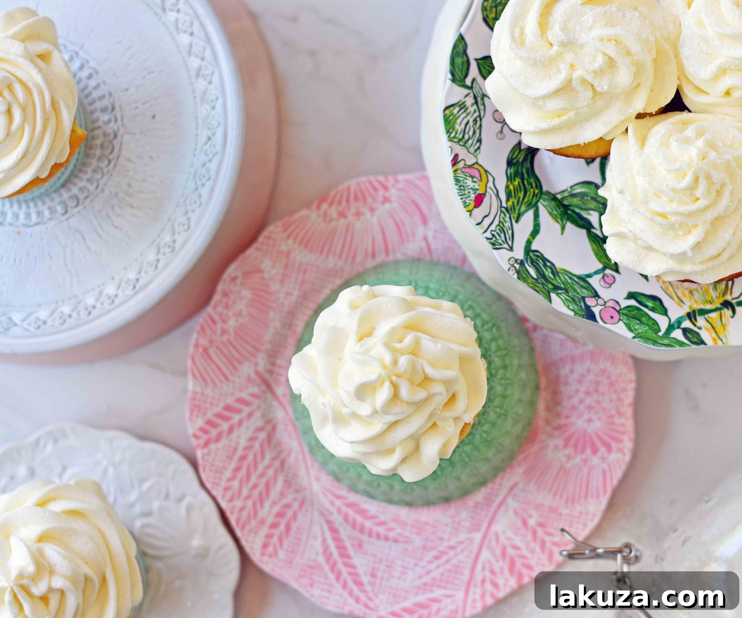 Perfect Vanilla Cupcakes 5 A delicious vanilla cupcake displayed on a clean surface, emphasizing its light texture and perfect frosting swirl.