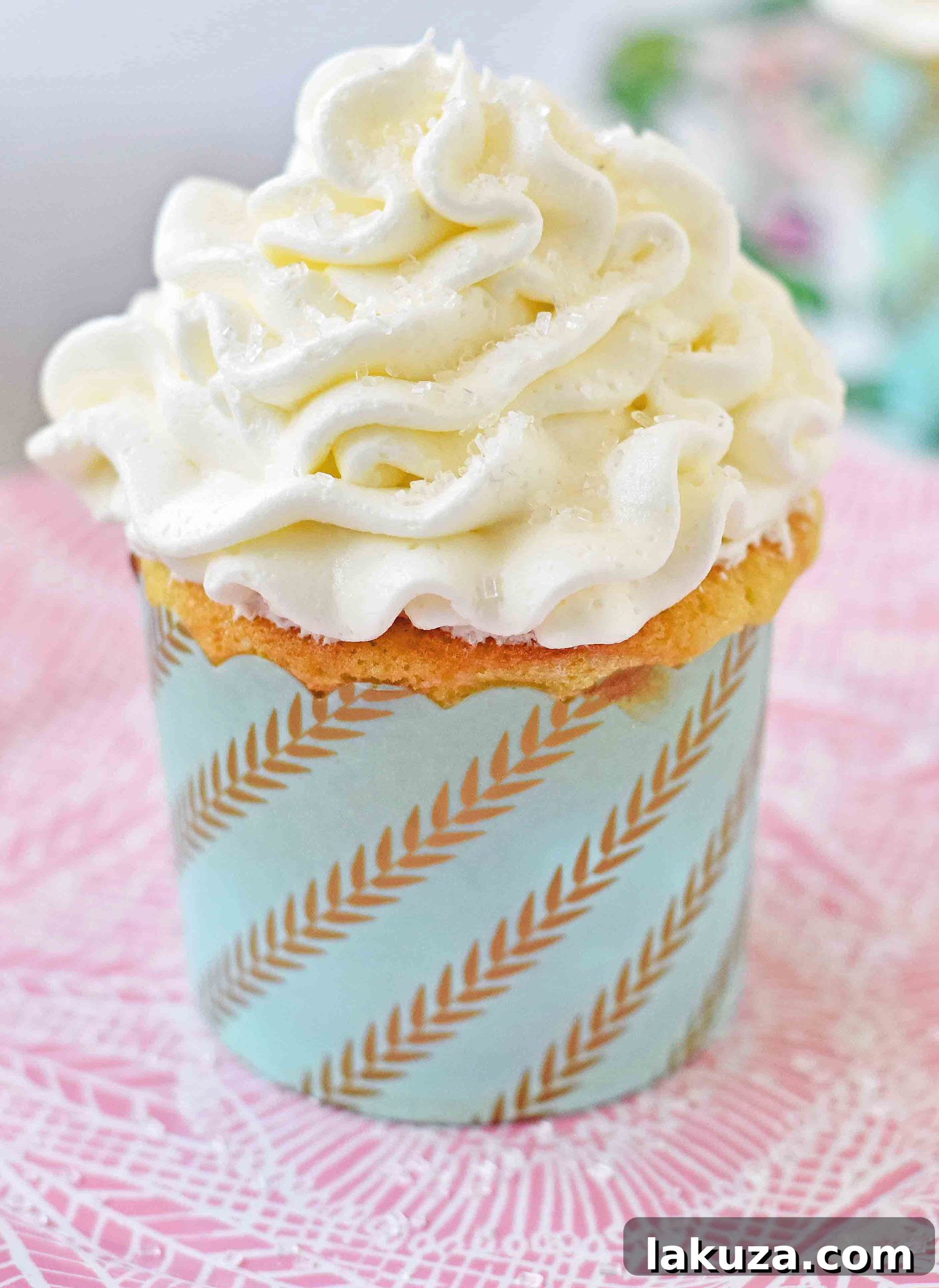 Perfect Vanilla Cupcakes 6 Close-up of the smooth, creamy vanilla buttercream frosting, ready to be piped onto cupcakes.