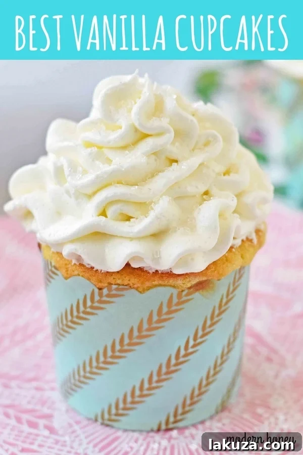 Perfect Vanilla Cupcakes 9 Nine delicious vanilla cupcakes with swirls of frosting, arranged on a serving tray.