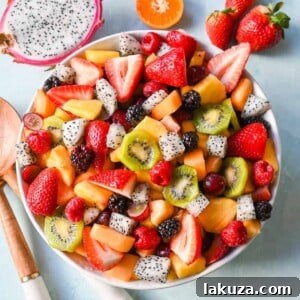 A bright and fresh fruit salad that is perfect for summertime! Made with vibrant and flavorful seasonal fruits and a sweet and simple honey lime dressing. The perfect fruit salad recipe!