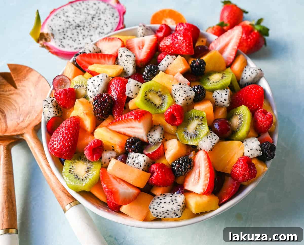 A bright and fresh fruit salad that is perfect for summertime! Made with vibrant and flavorful seasonal fruits and a sweet and simple honey lime dressing. The perfect fruit salad recipe!