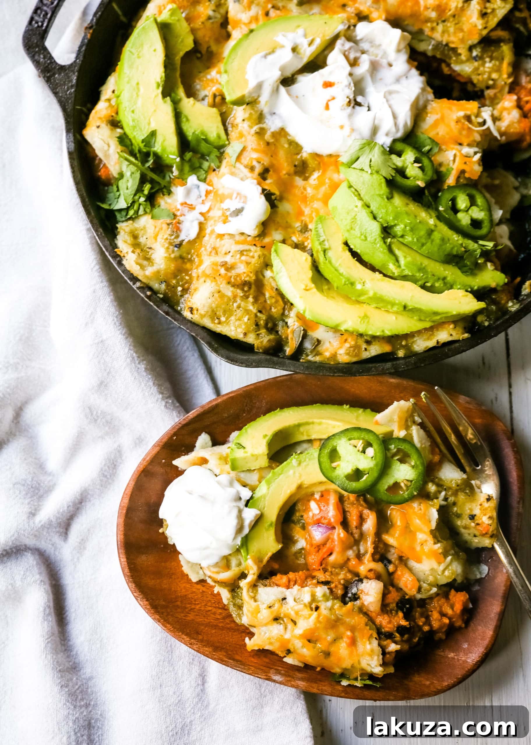 Zesty Sweet Potato and Black Bean Enchiladas 7 A beautifully baked dish of Sweet Potato Black Bean Enchiladas, golden and bubbly from the oven, topped with rich melted Mexican cheeses and tangy salsa verde.