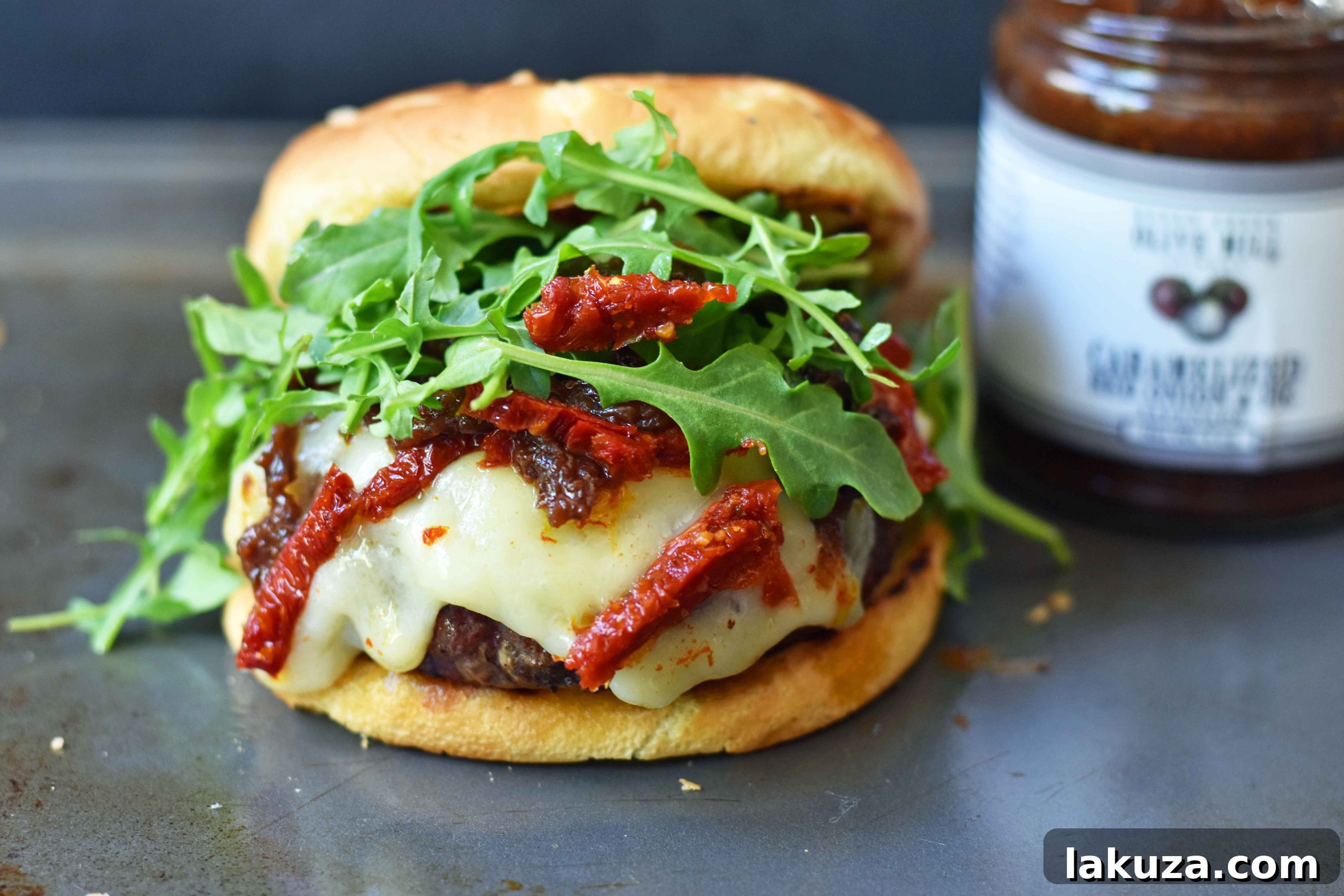 Decadent Brie Burger with Caramelized Onions and Sun-Dried Tomatoes 3 Brie Burger with Caramelized Onions and Sundried Tomatoes The Ultimate Burger with melted Brie Cheese, Sundried Tomatoes, Queen Creek Olive Mill Caramelized Red Onion Fig Tapenade, and Arugula. How to make the perfect burger. www.modernhoney.com