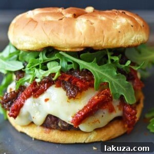 Decadent Brie Burger with Caramelized Onions and Sun-Dried Tomatoes 6 Brie Burger with Caramelized Onions and Sundried Tomatoes The Ultimate Burger with melted Brie Cheese, Sundried Tomatoes, Queen Creek Olive Mill Caramelized Red Onion Fig Tapenade, and Arugula. How to make the perfect burger. www.modernhoney.com