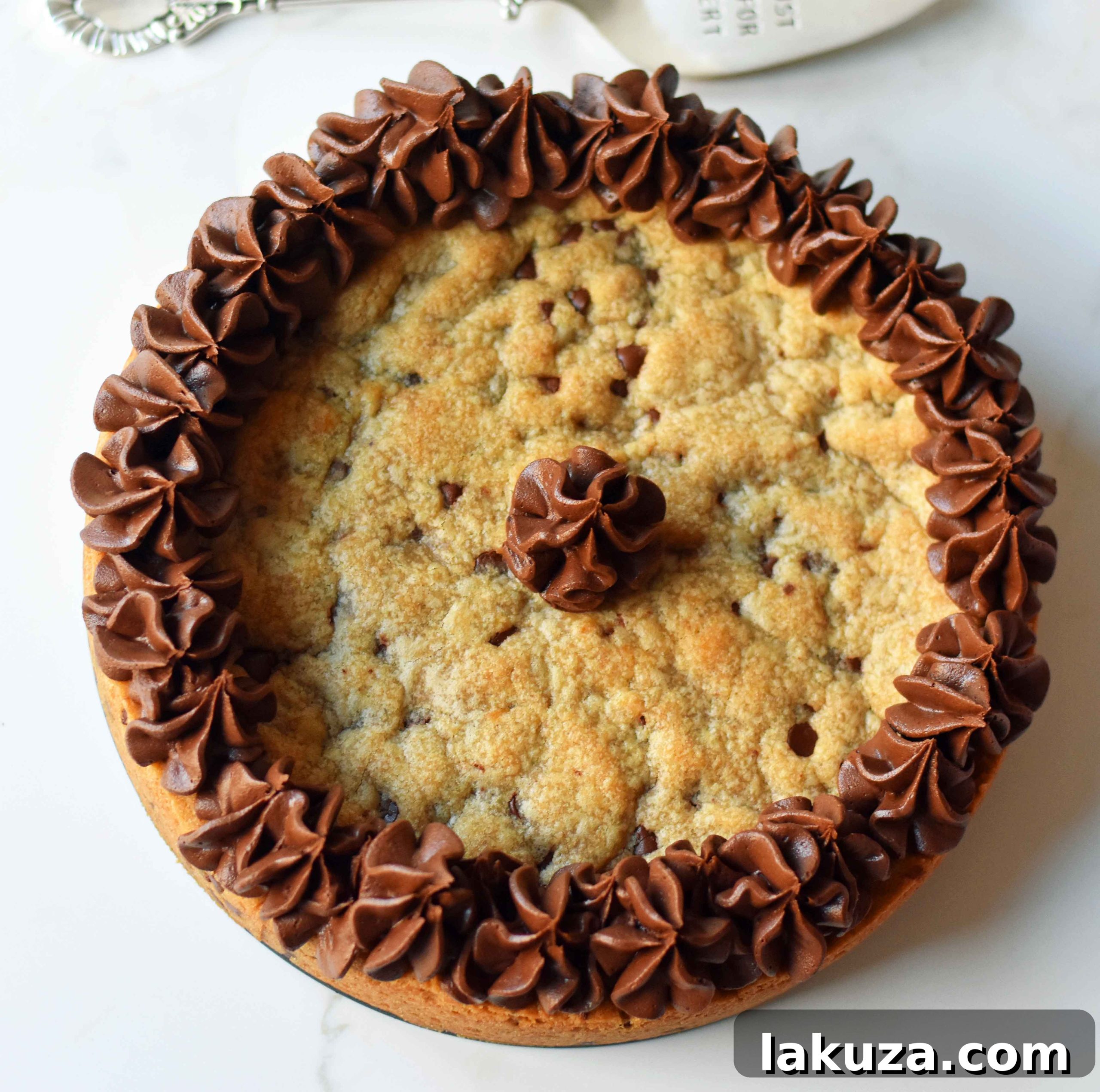 Overhead view of a perfectly baked chocolate chip cookie cake before frosting