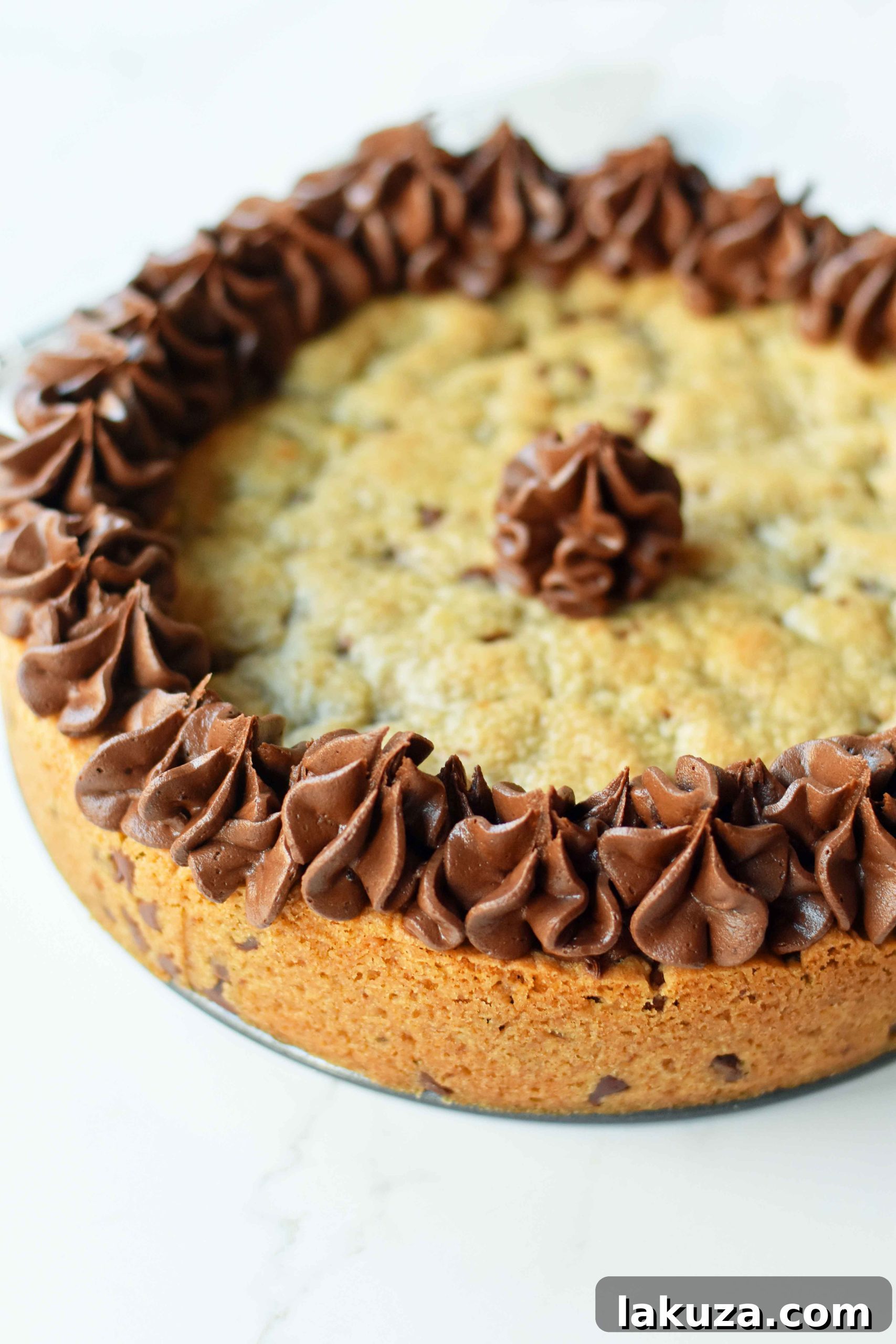 Colorful assortment of frosting and sprinkles on a delicious cookie cake