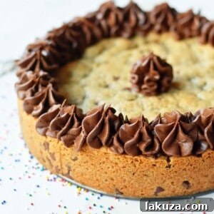 The ultimate chocolate chip cookie cake decorated with frosting