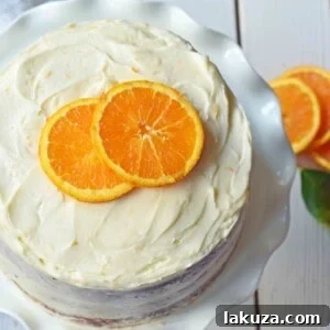 Homemade Orange Cake with Sweet Orange Cream Cheese Frosting. How to make the best orange cake. Orange cake with orange frosting. Naked orange cake.